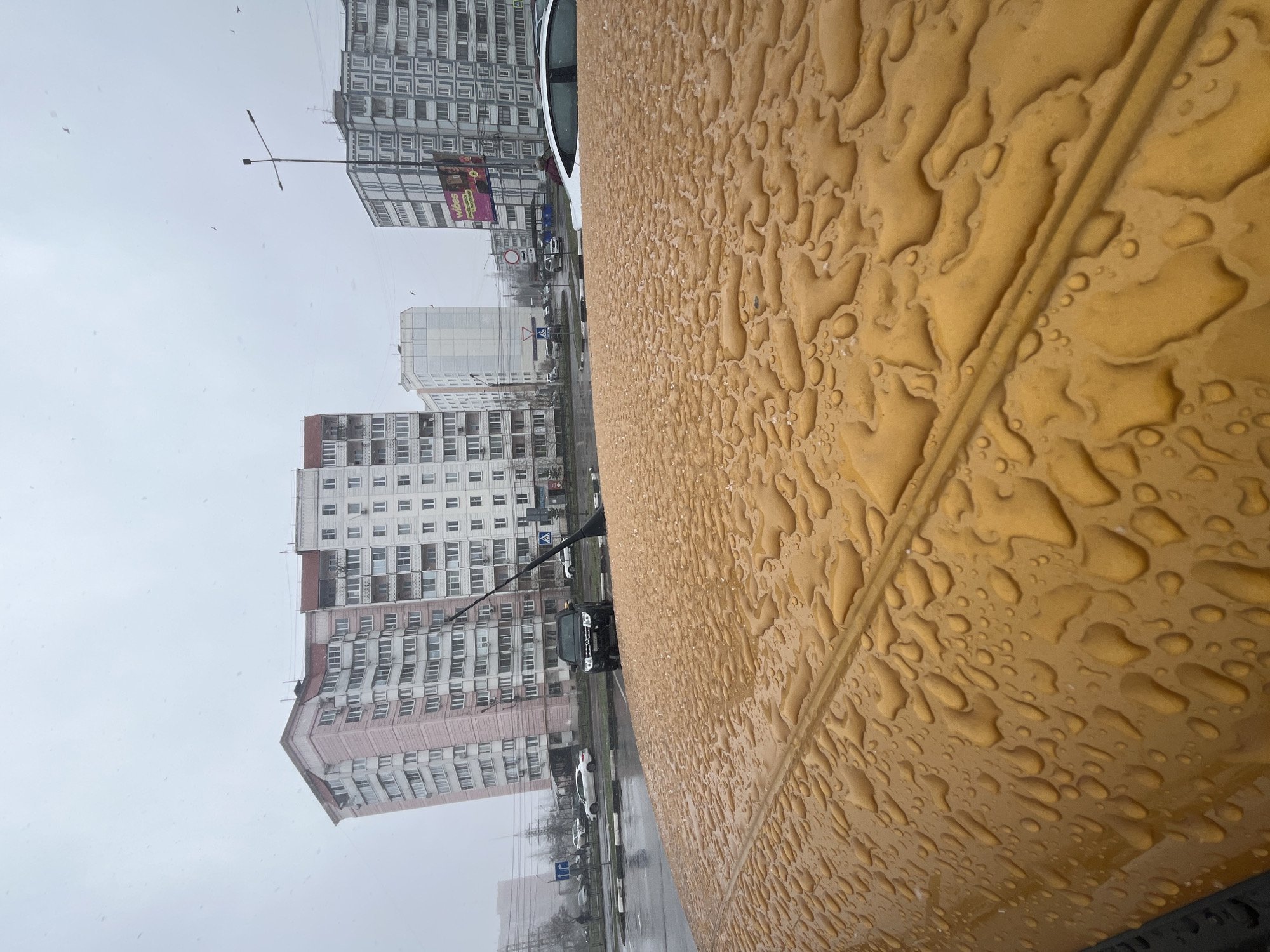 Rainy weather observed in Klin, Russia with tractor traffic
