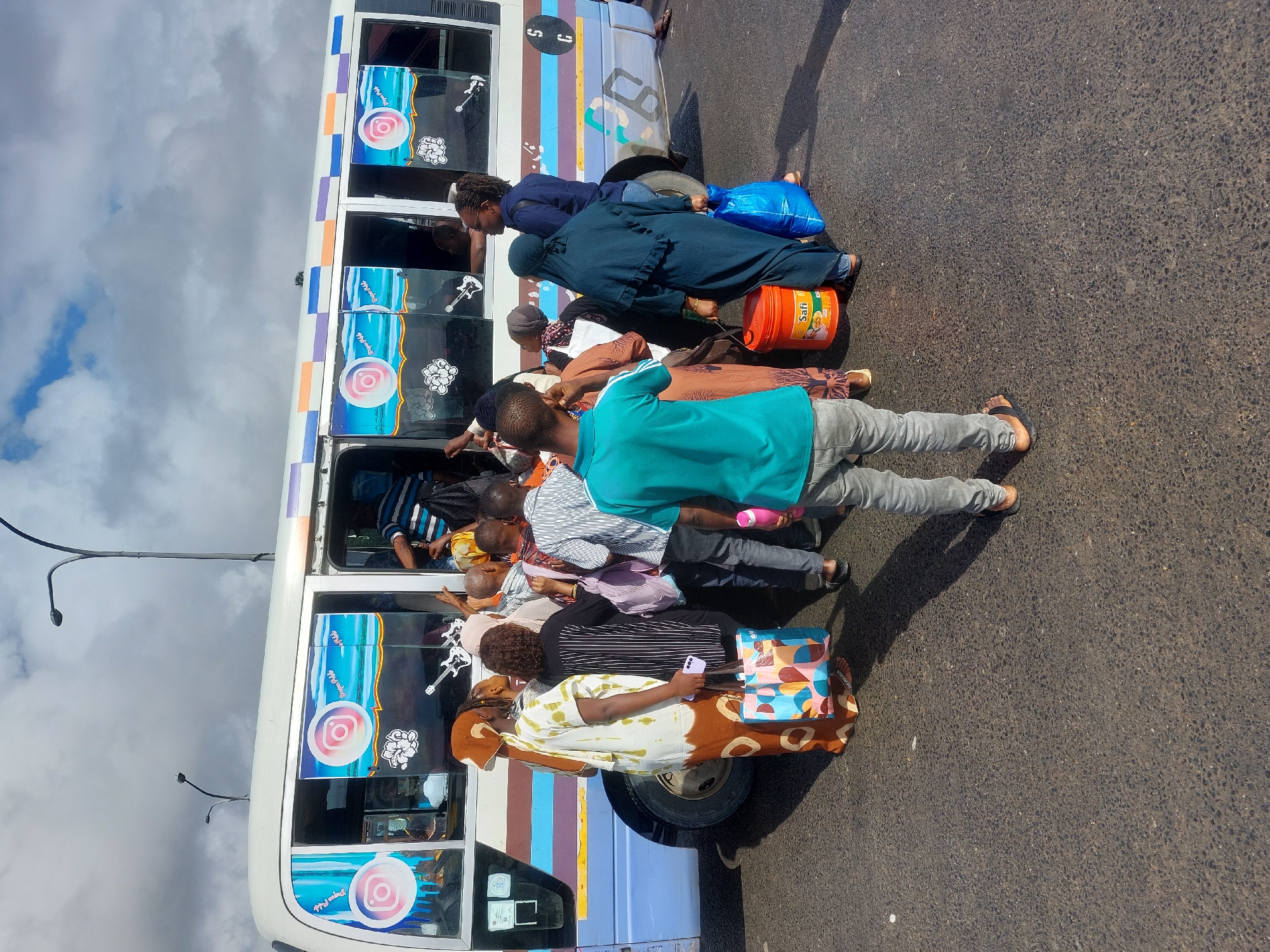 Morning commuter activity with dala-dala buses in Dar es-Salaam