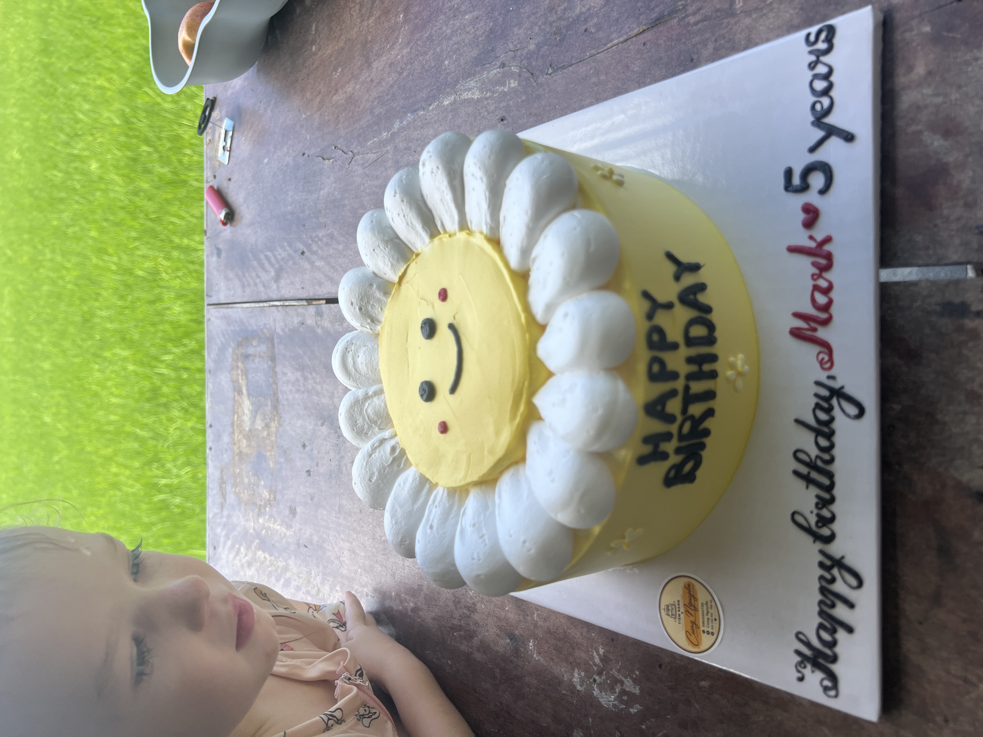 Cheerful daisy-shaped cake on a table in Hoi An