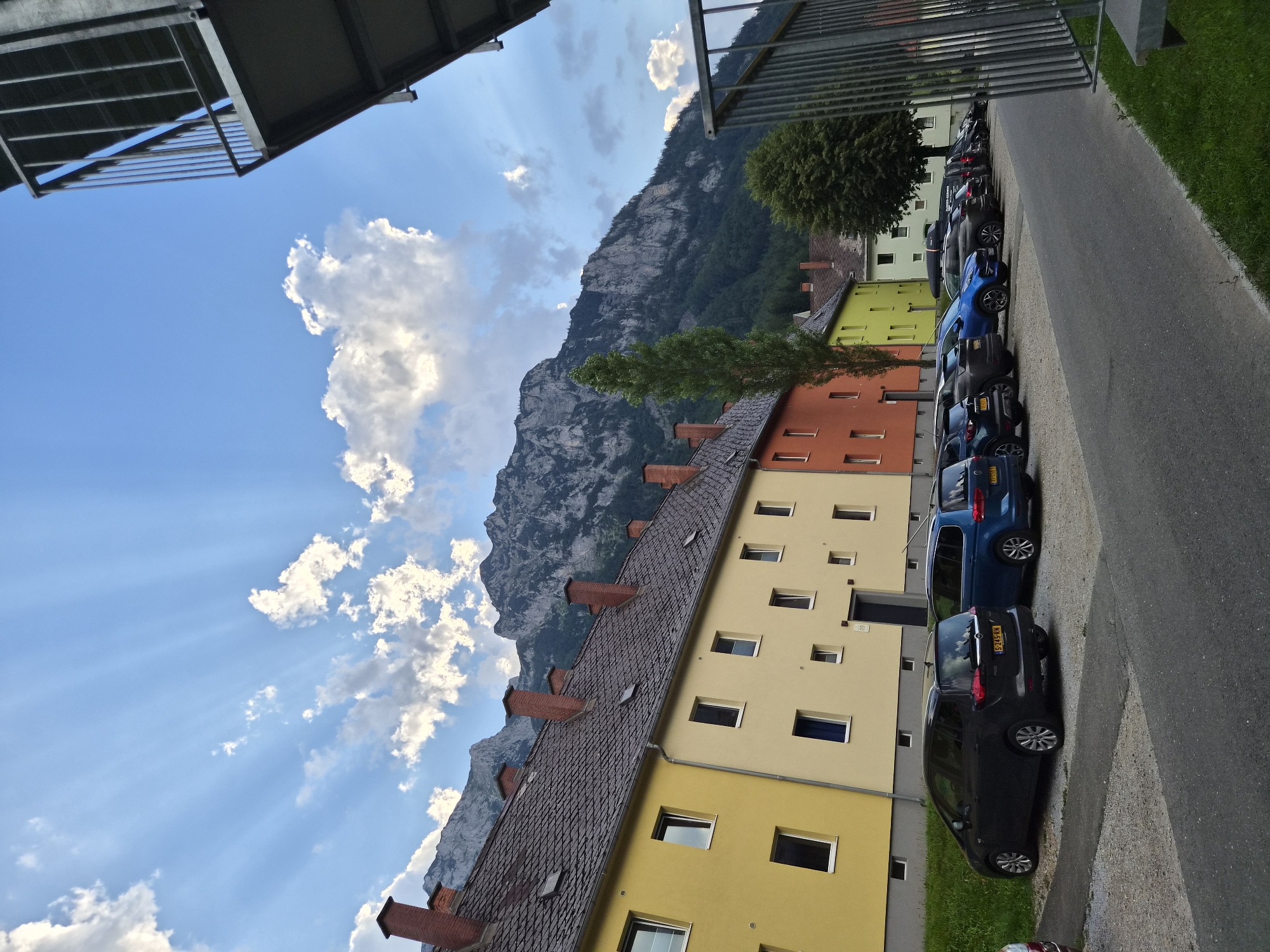 Dog on a doorstep, Alps in the background, Eisenerz