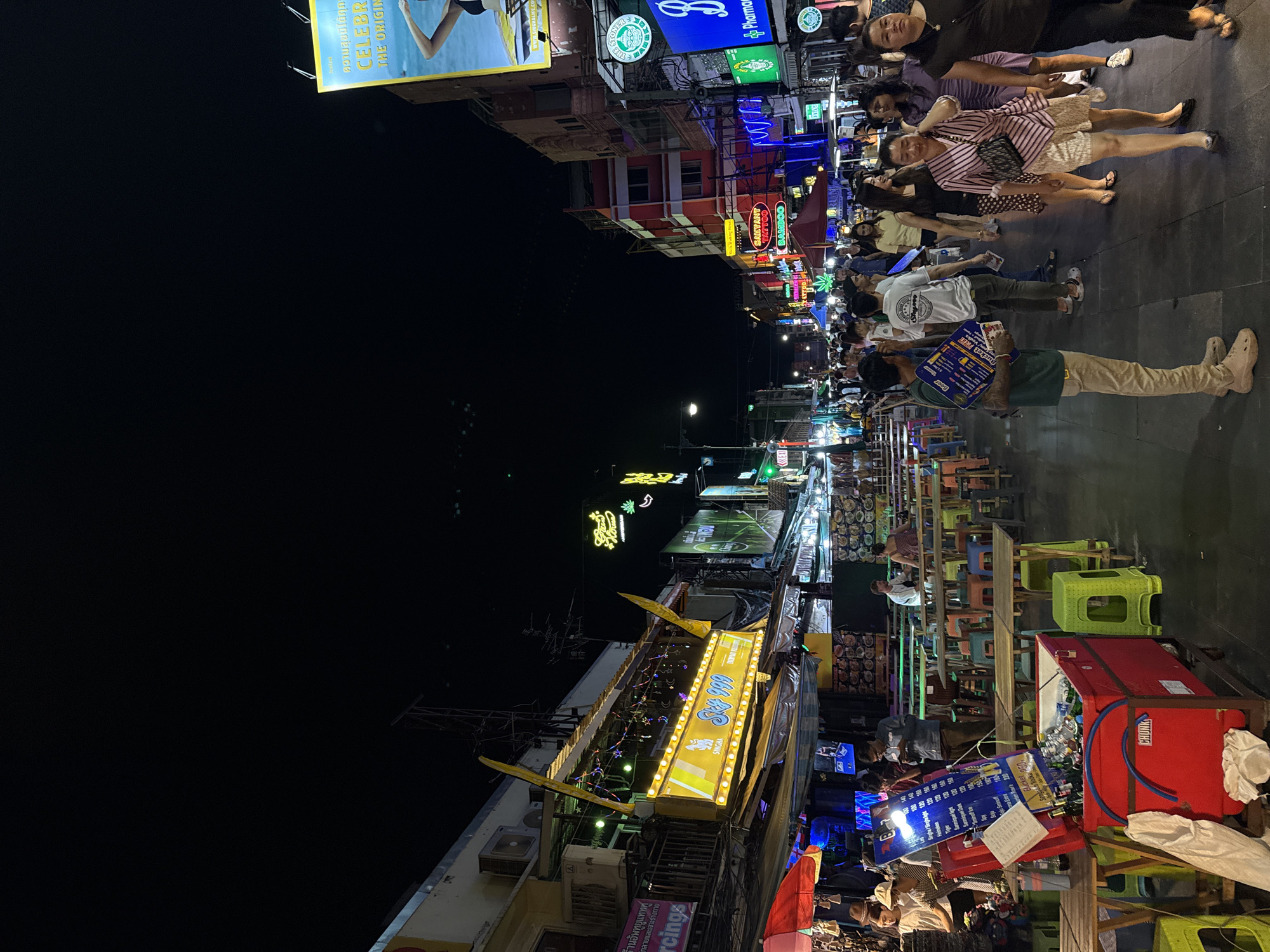 Khao San Road buzzing at night with street food and neon