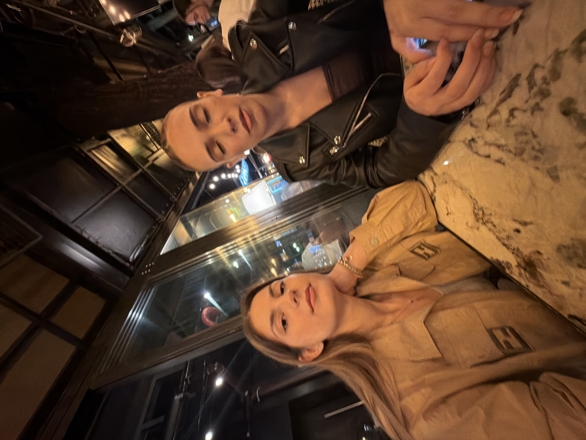 Two women share dinner and selfies at Sofia restaurant