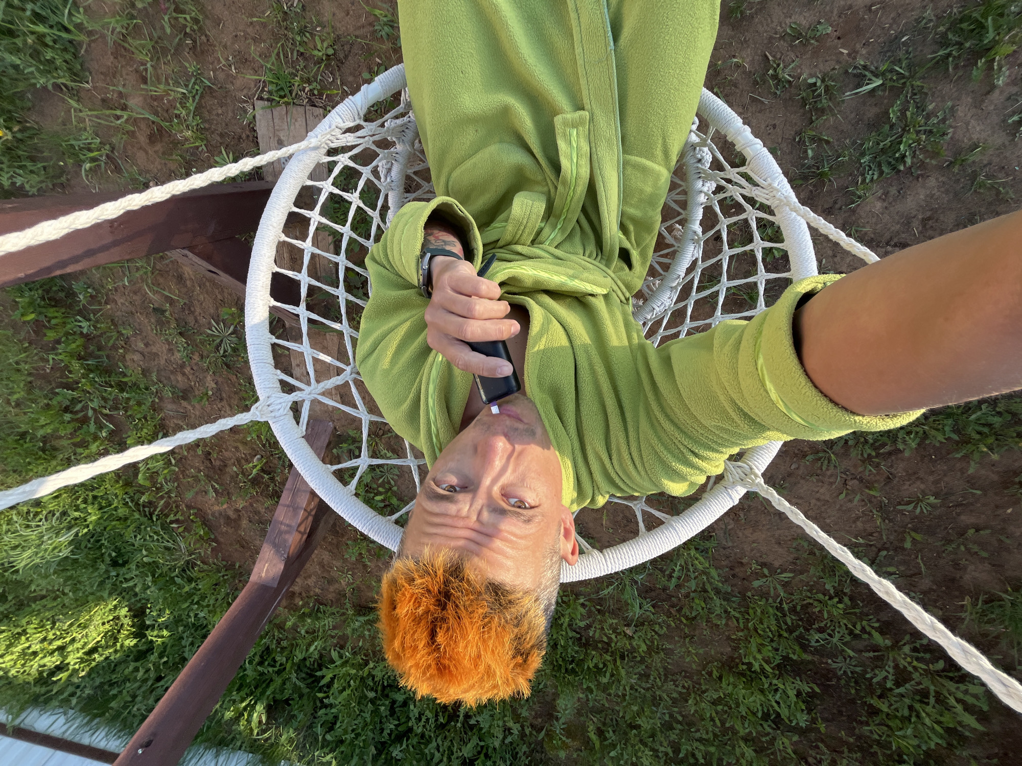 Woman photographed with lilacs and dogs in Chaikovsky, Russia