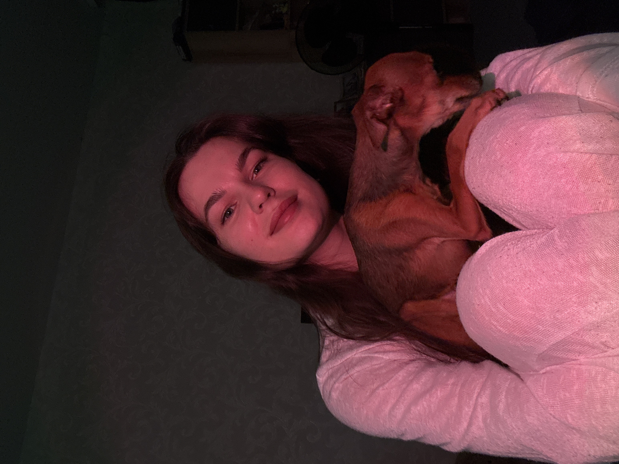 Woman documents selfie session with pet dog in Chaikovsky
