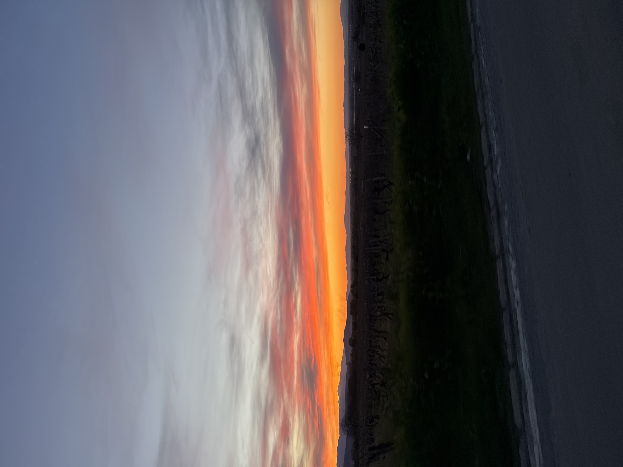 Sunset observed in Brestovitsa, Bulgaria displays orange-red light band
