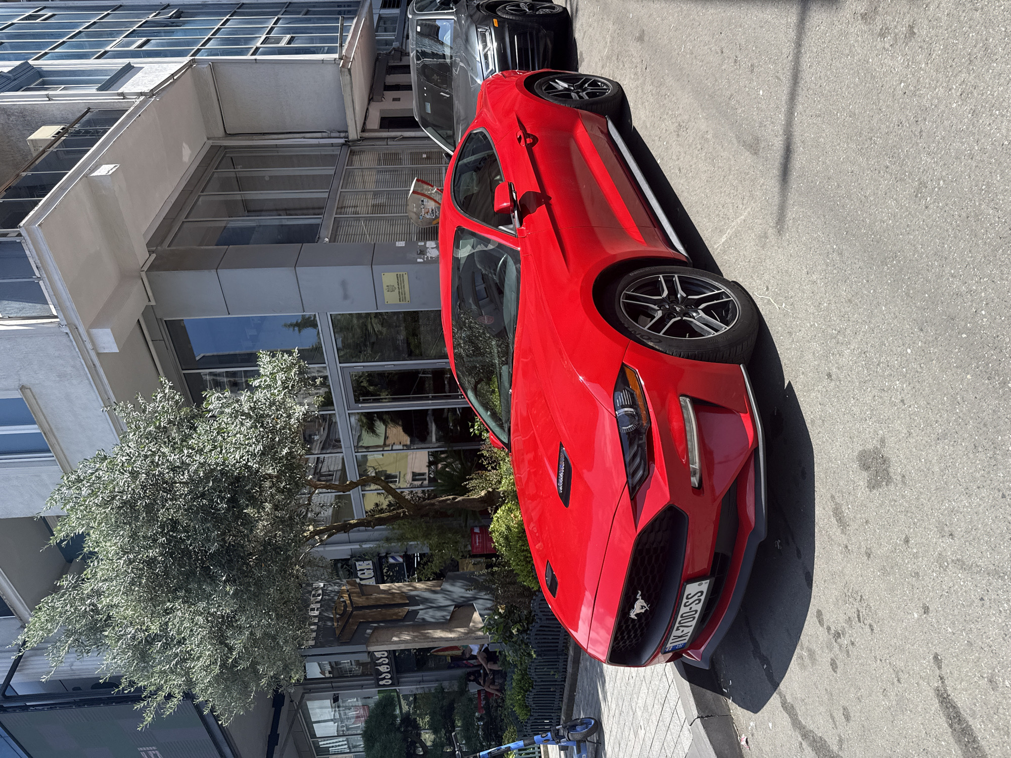 European city morning: architecture, fountains, street food, and Mustangs