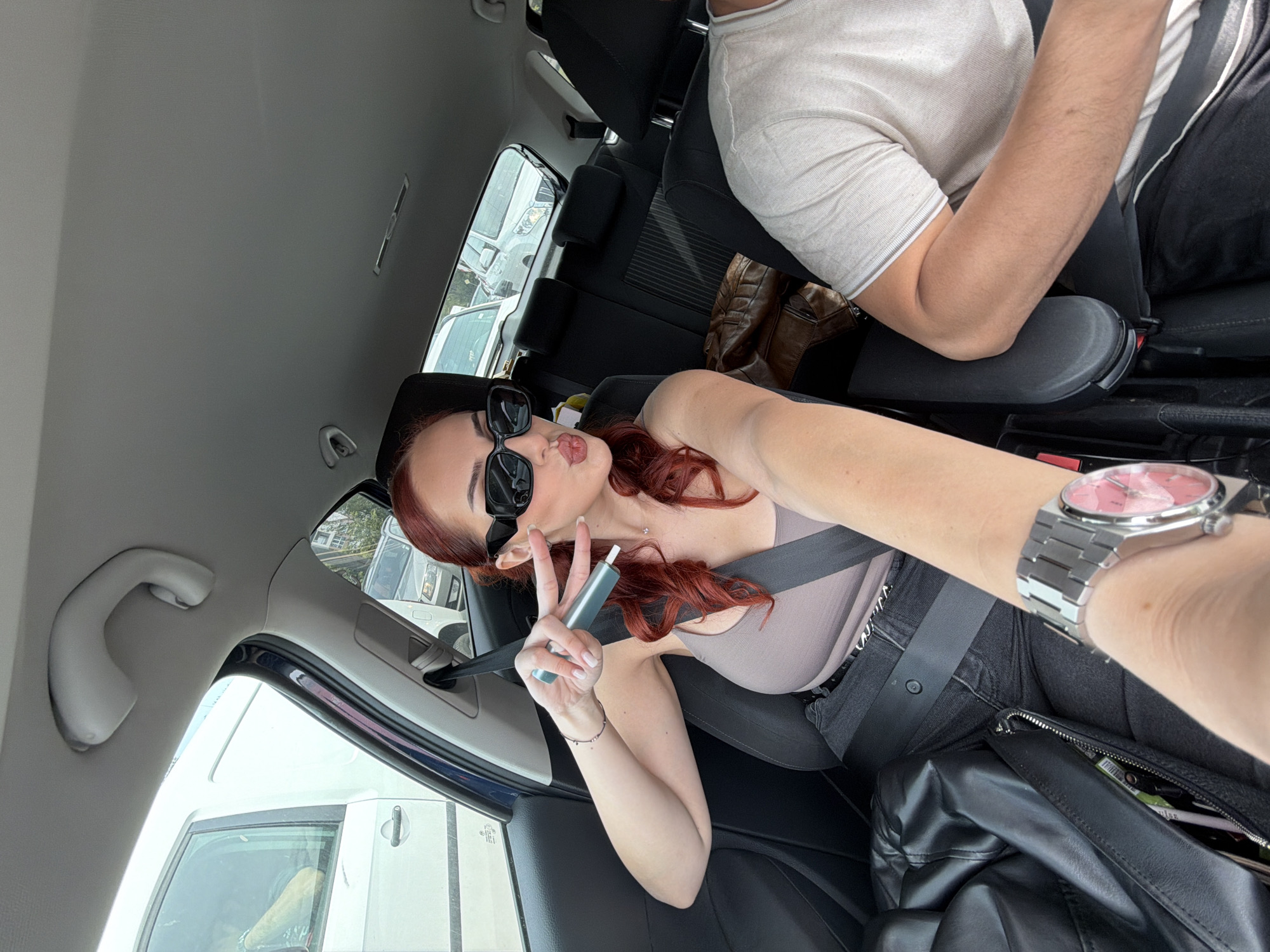 Two people photographed in car in Sofia, Bulgaria