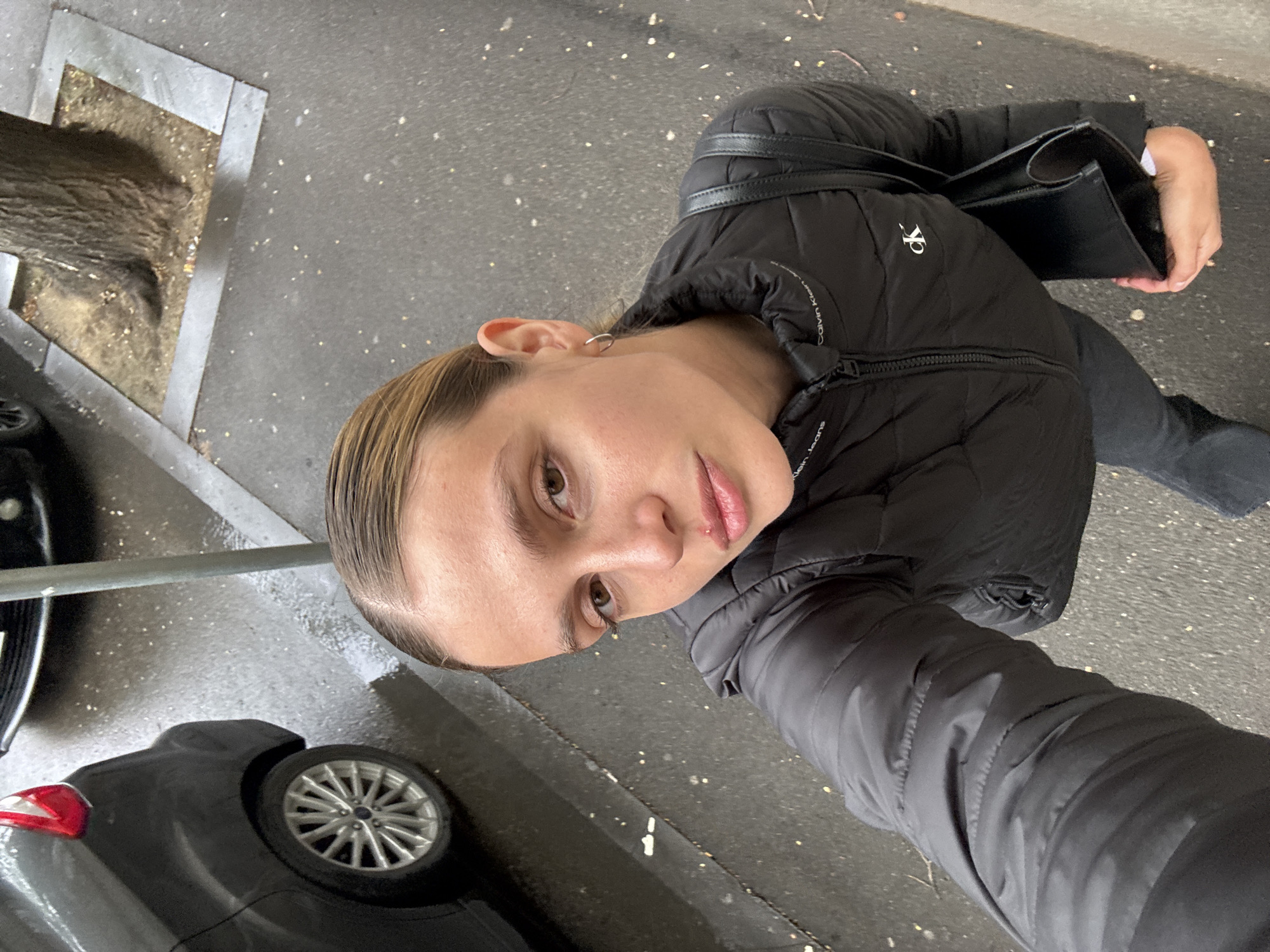 Woman takes cheerful selfies in downtown Tbilisi