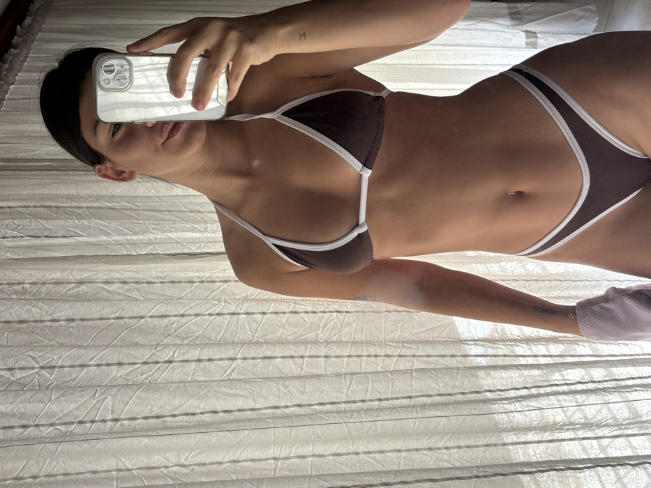 Woman's morning routine documented in bikini, breakfast setting