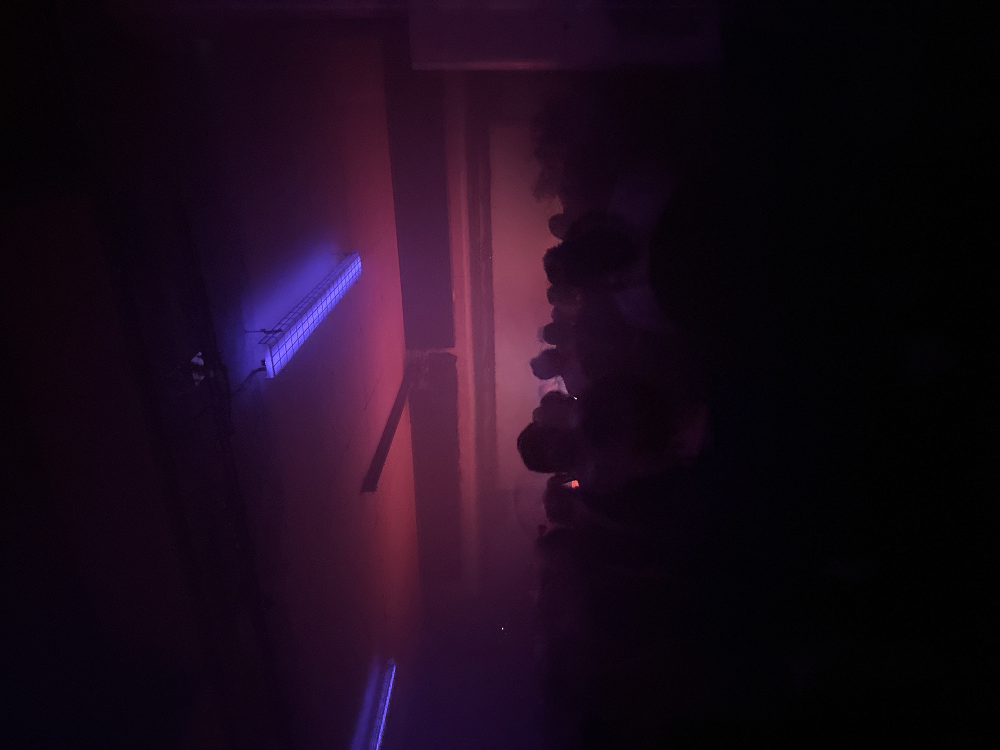 Dark space with colored lighting captured in Paris