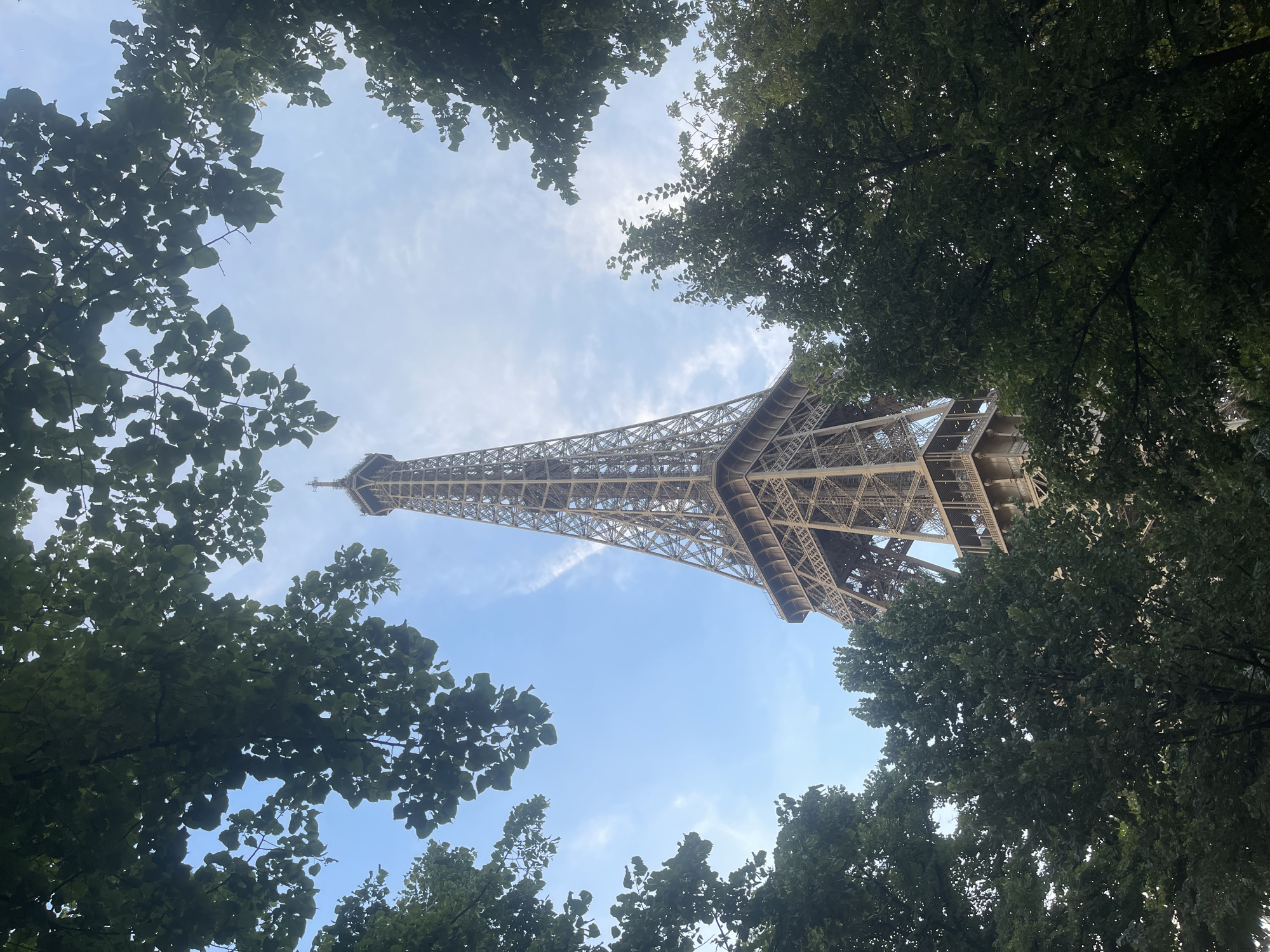 Eiffel Tower from multiple angles on a clear July evening