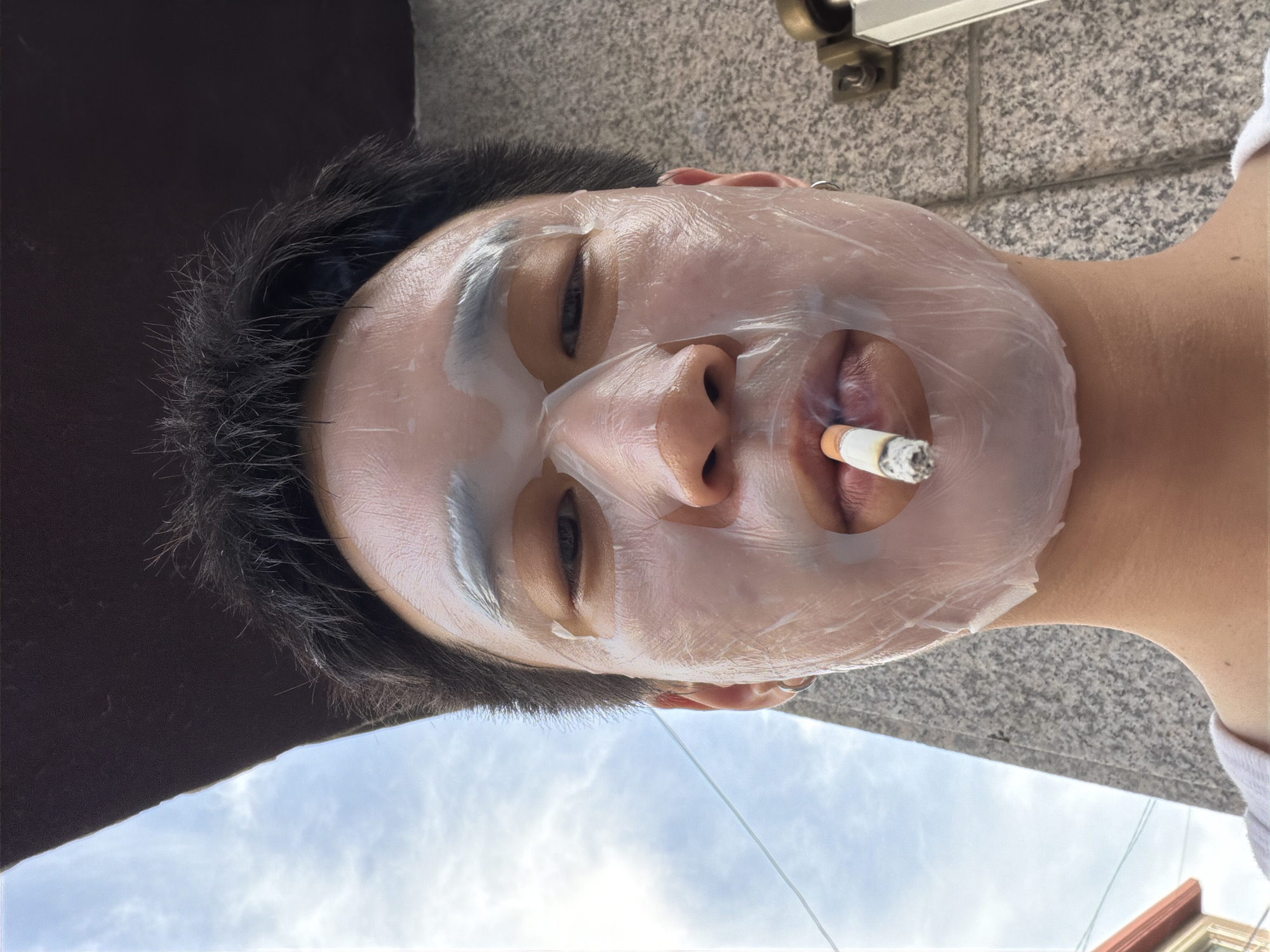Masked smoker photographed in Guri-si, South Korea