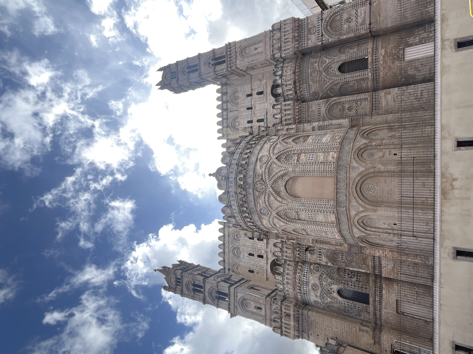 Tourist documents Palermo Cathedral and street art in Sicily