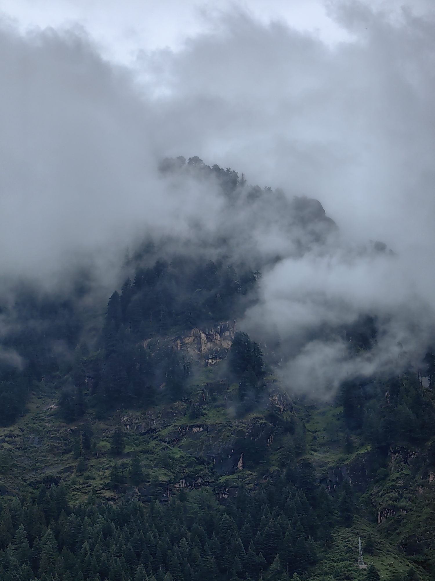 Misty mountain bus depot in Siumsa, with a roadside meal nearby