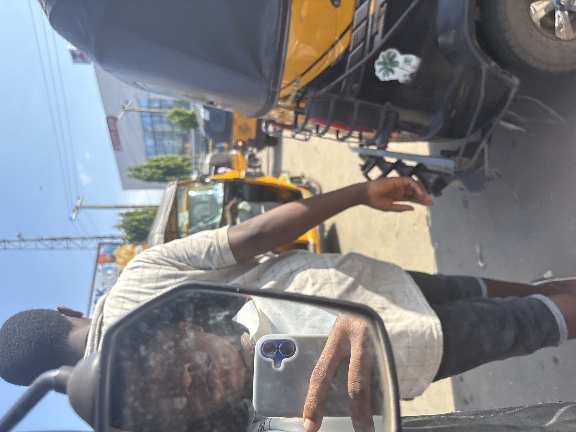 Street-level keke rides through a busy Anambra urban corridor