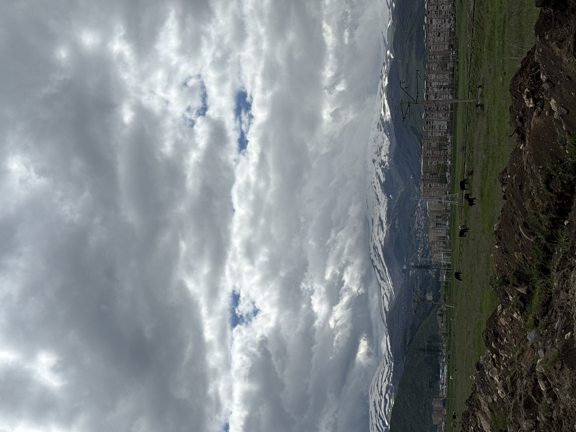 Cloudy skies over snow-covered mountains observed in Hrazdan, Armenia