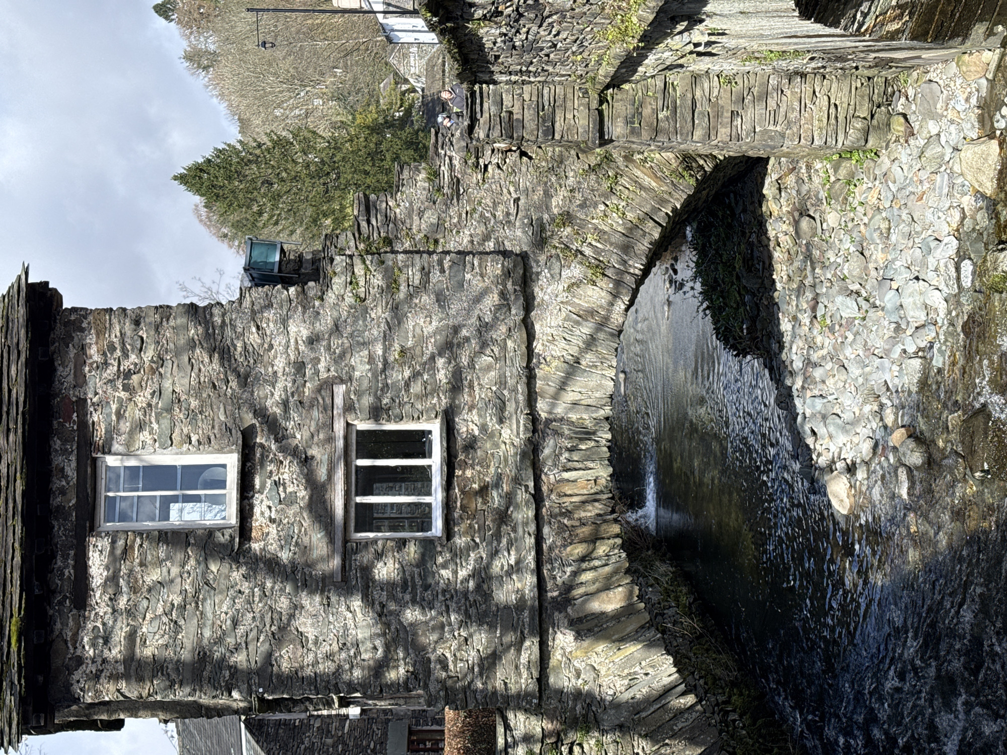 Tourist captures Bridge House and village scenes in Ambleside