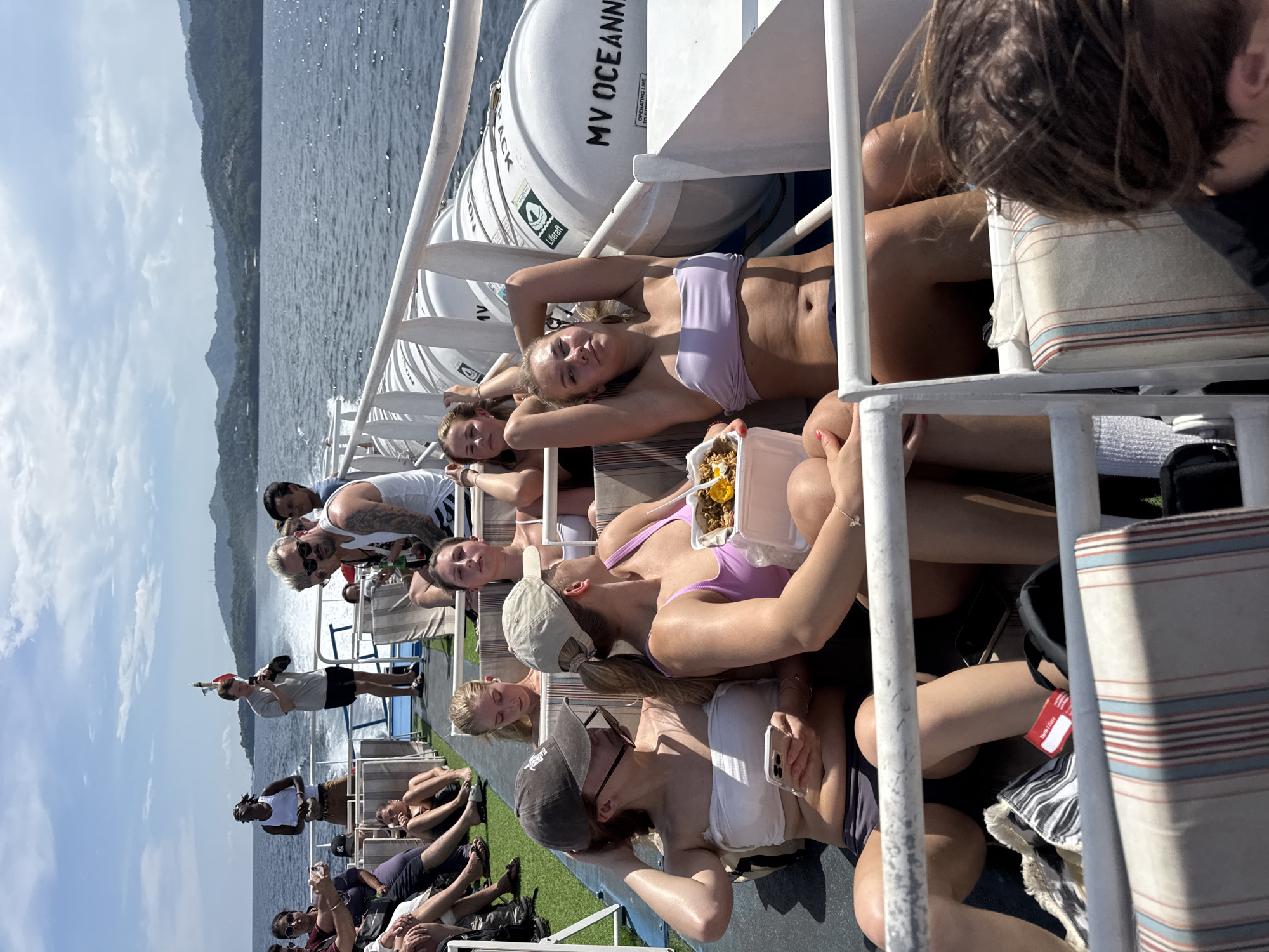 Ferry passengers travel across Indonesian waters during morning journey