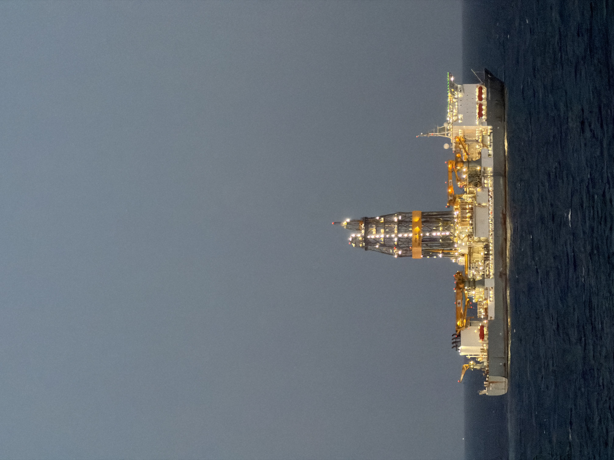 Offshore drilling platform spotted at sea during dawn hours
