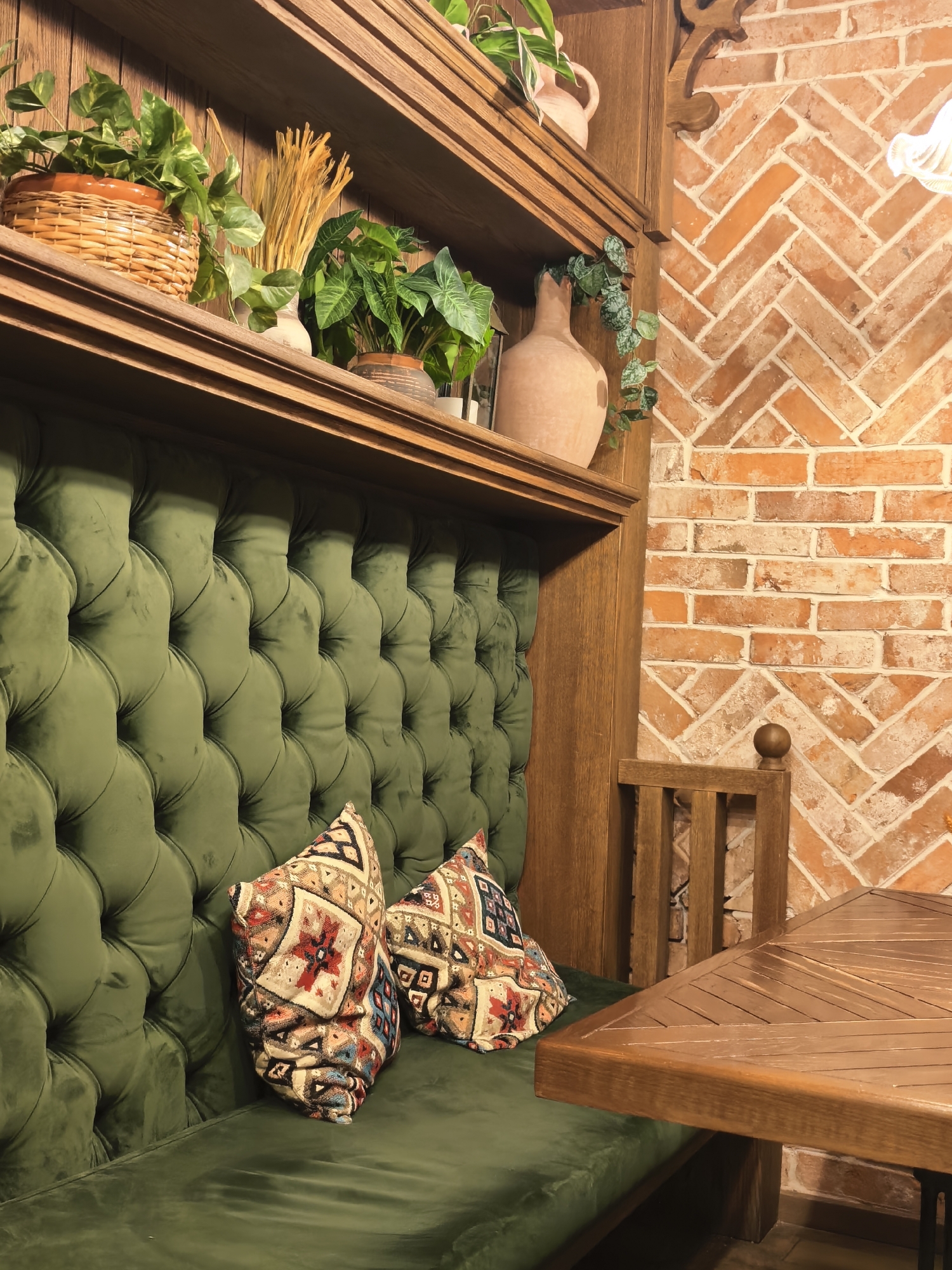 Inside a cozy rustic café with swings, velvet booths, and tea