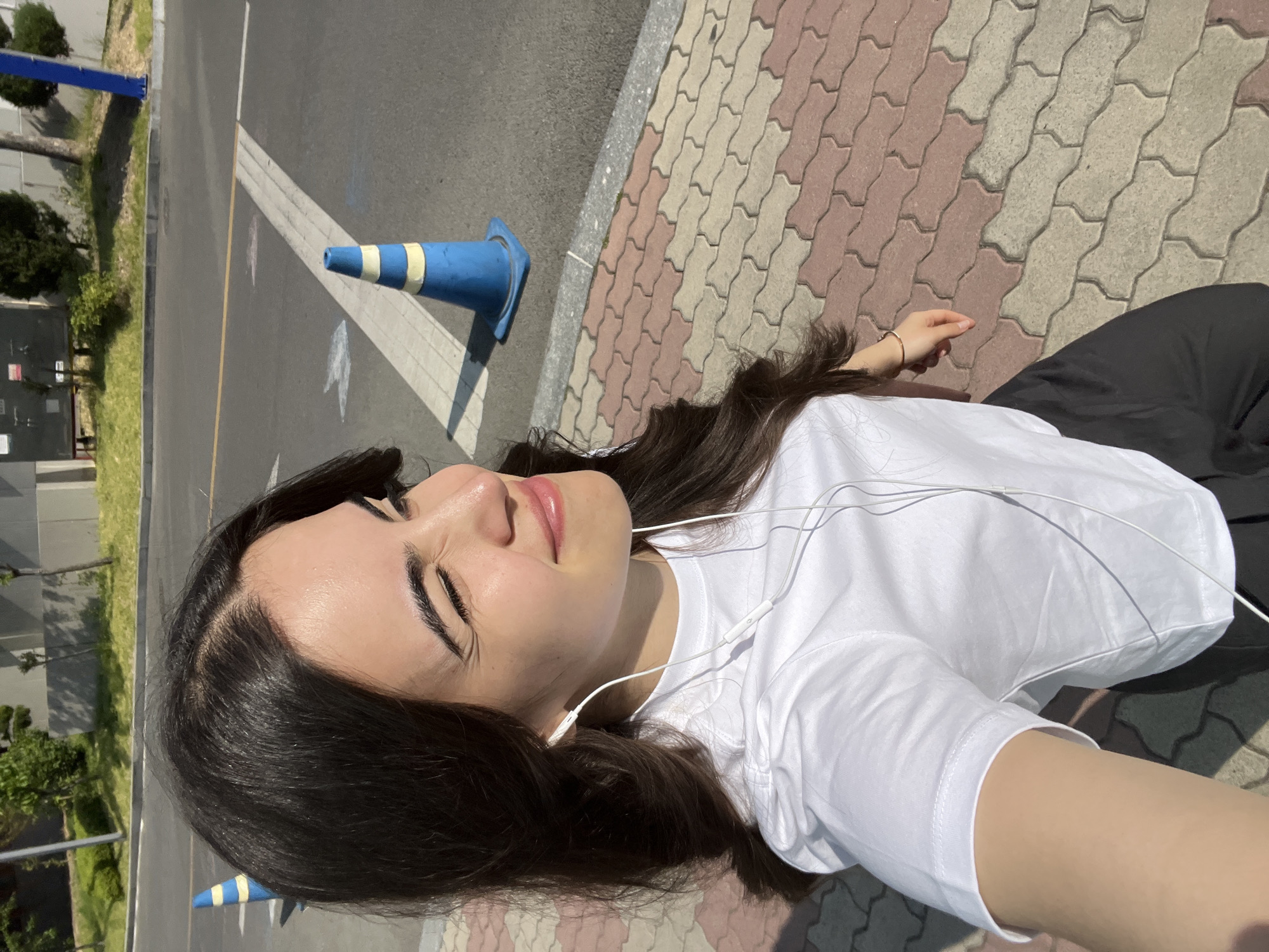 Woman photographed in multiple poses on Daegu street