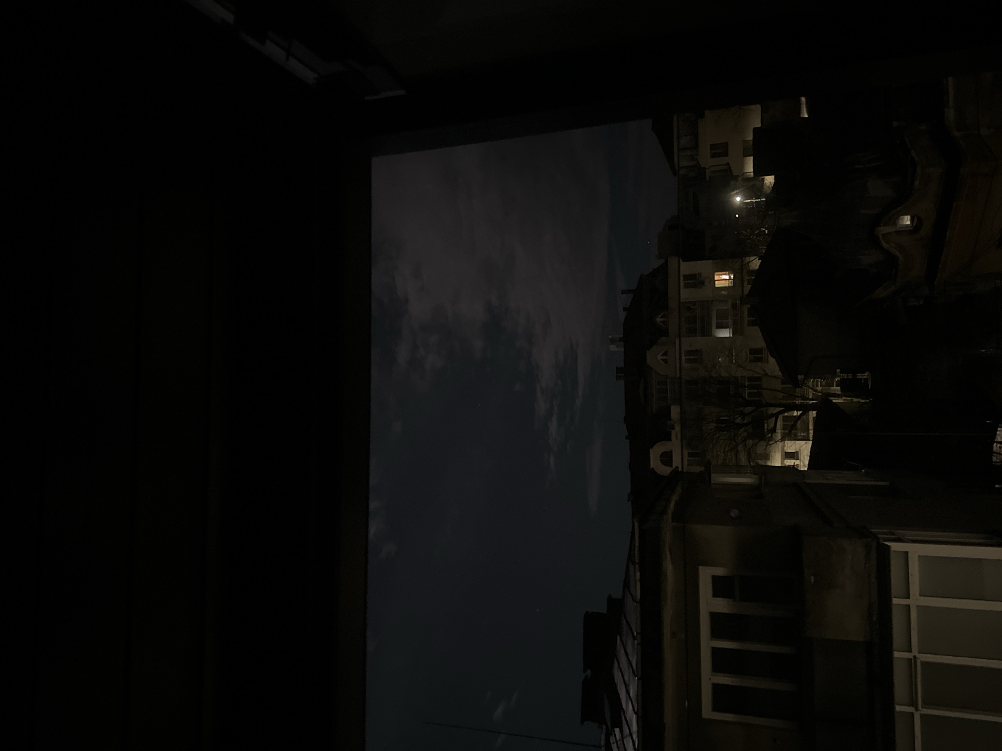Night view of Ruse apartment buildings from interior