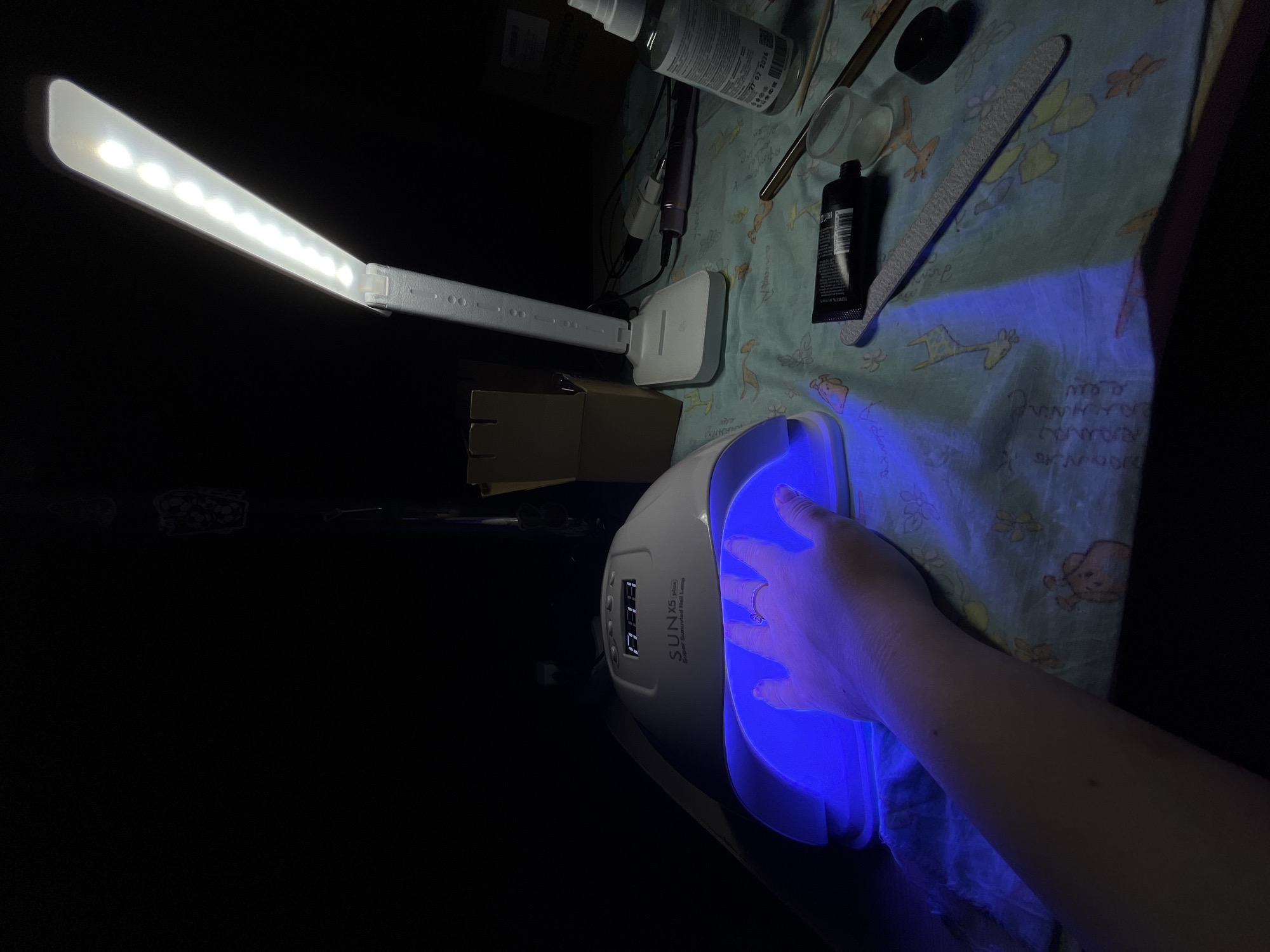 Woman gets manicure treatment in Novopokrovskaya, Russia