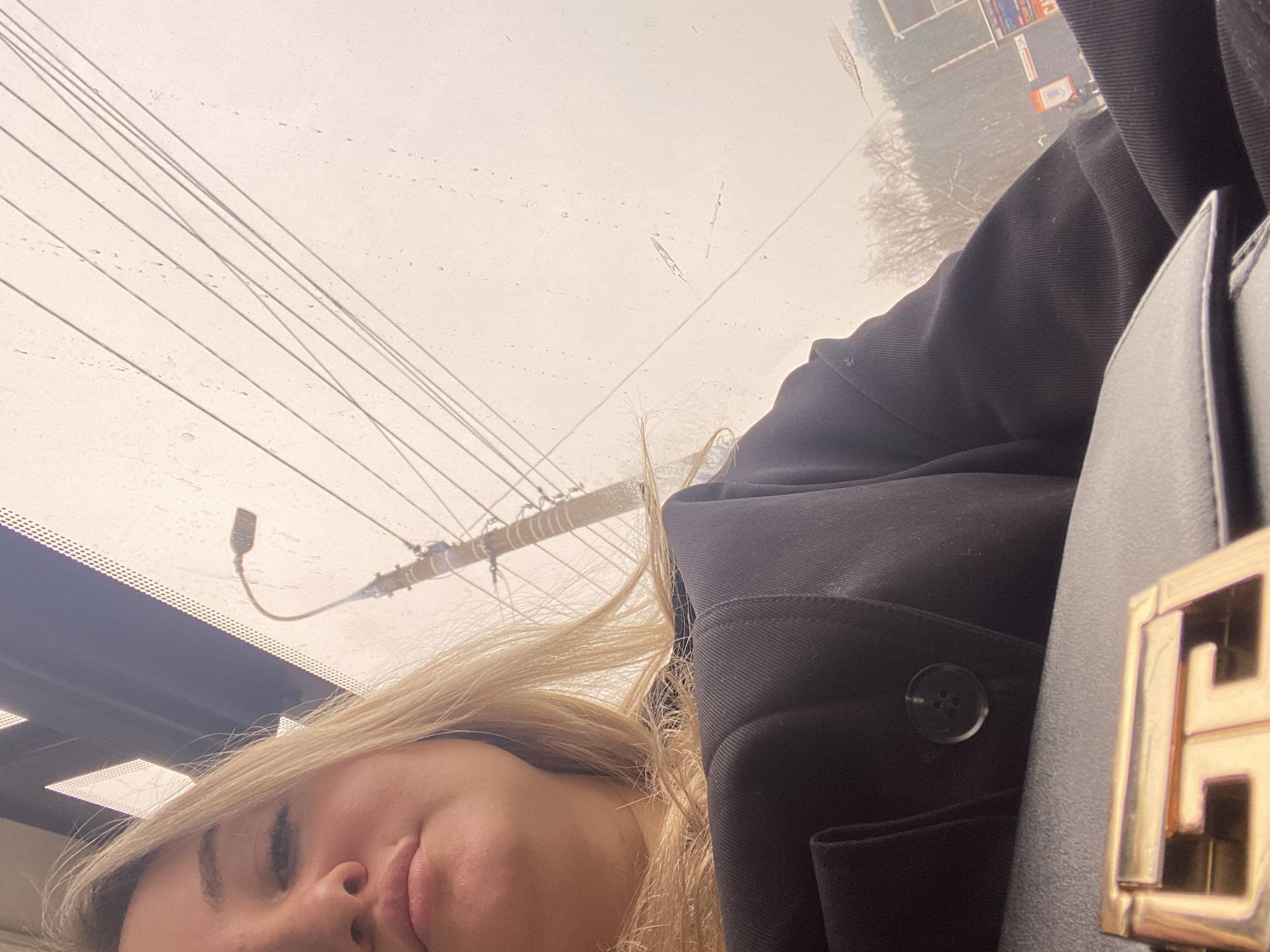 Woman in vehicle during rainy weather in Izhevsk