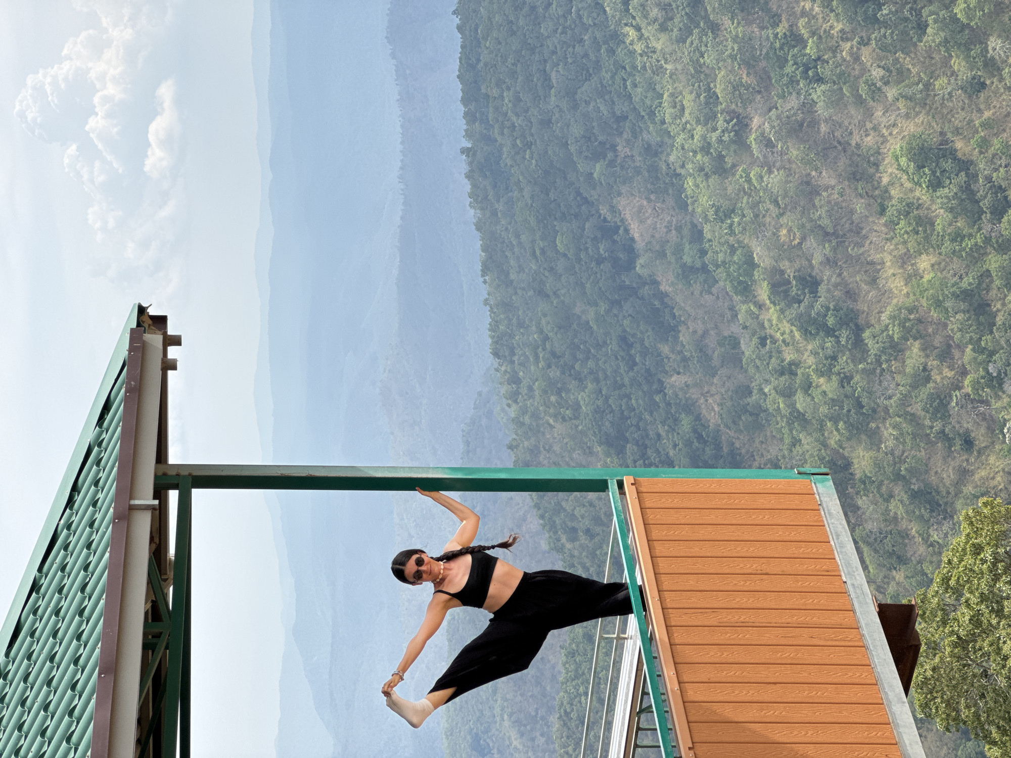 Woman performs acrobatics on building structure in Vietnam