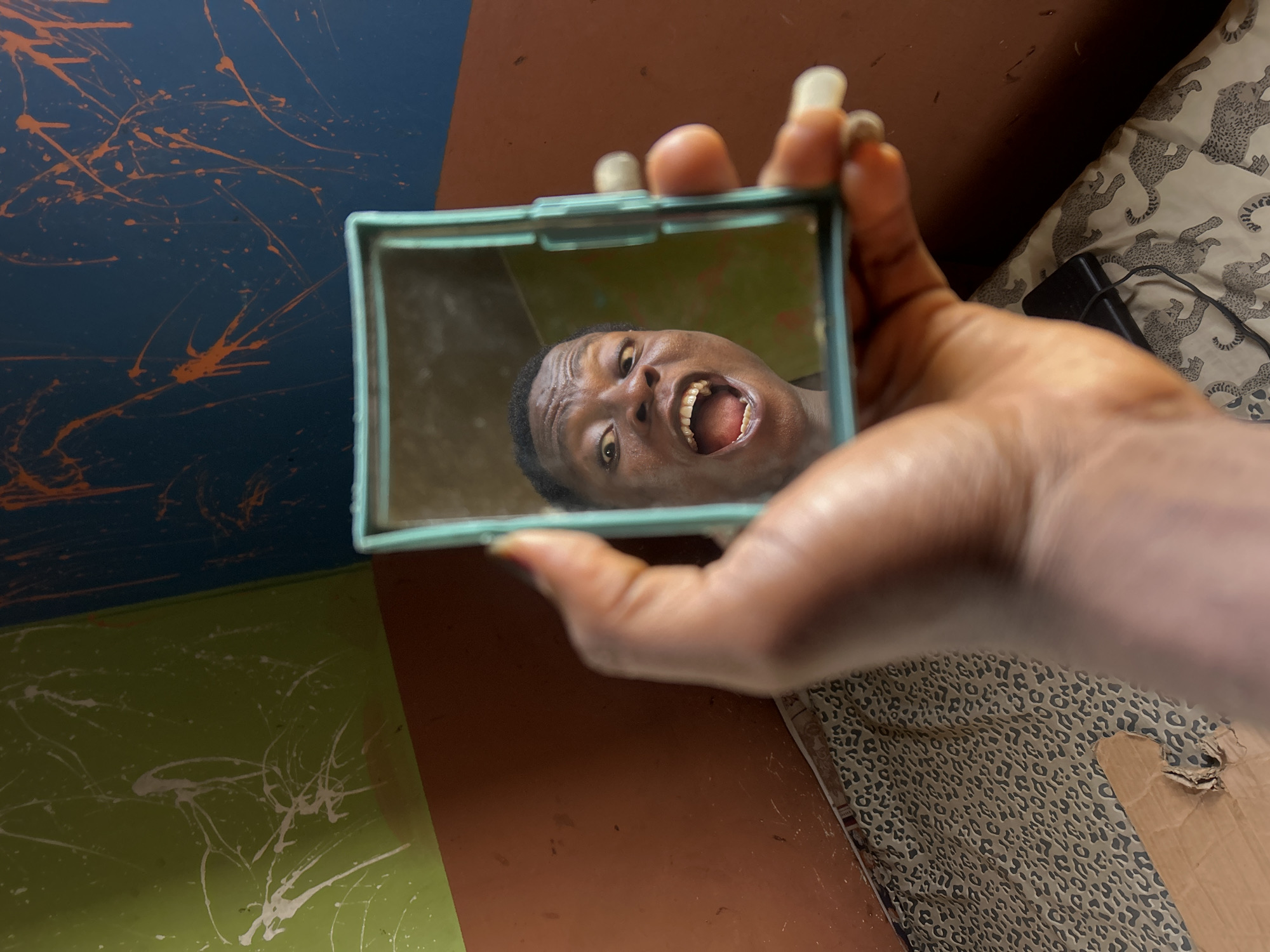 Person captured making expressive faces in playful photo session