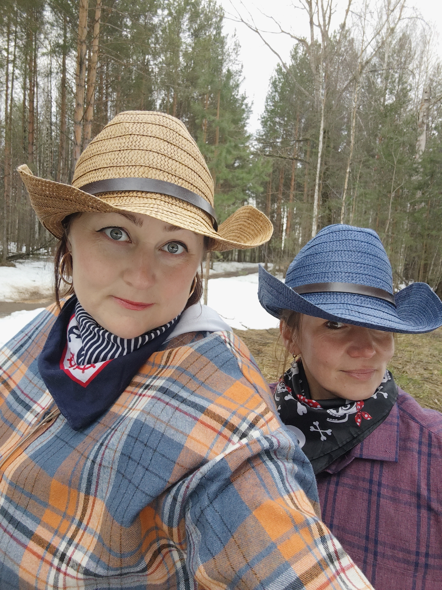 Women pose with toy horses in Russian woods