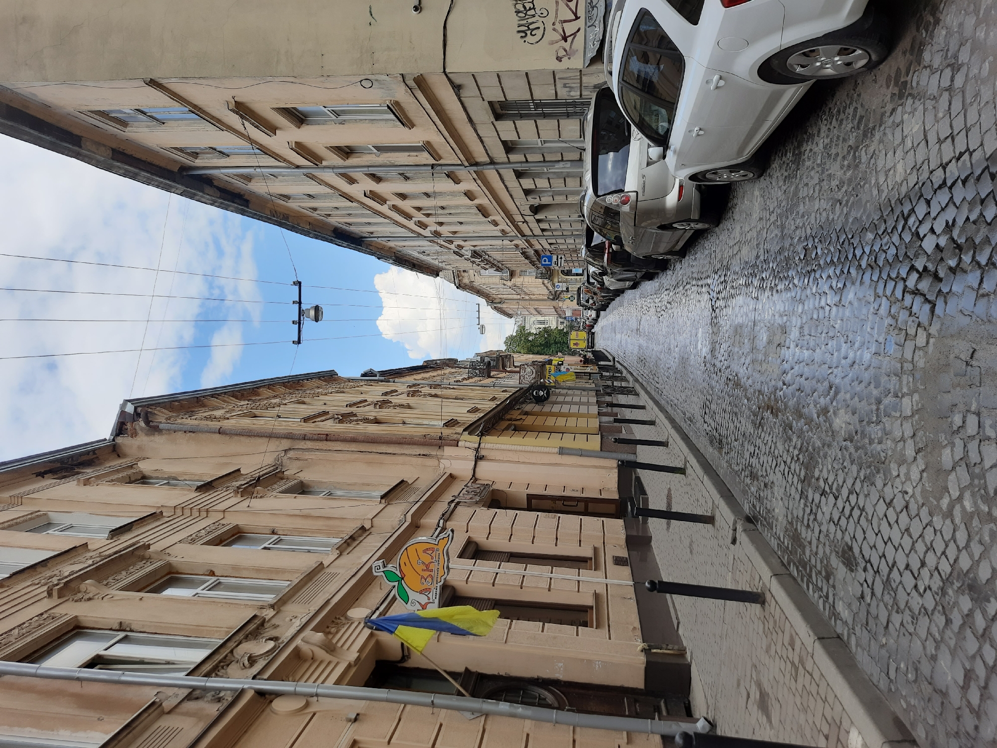 Rainy afternoon in Lviv's historic center, trams and old streets