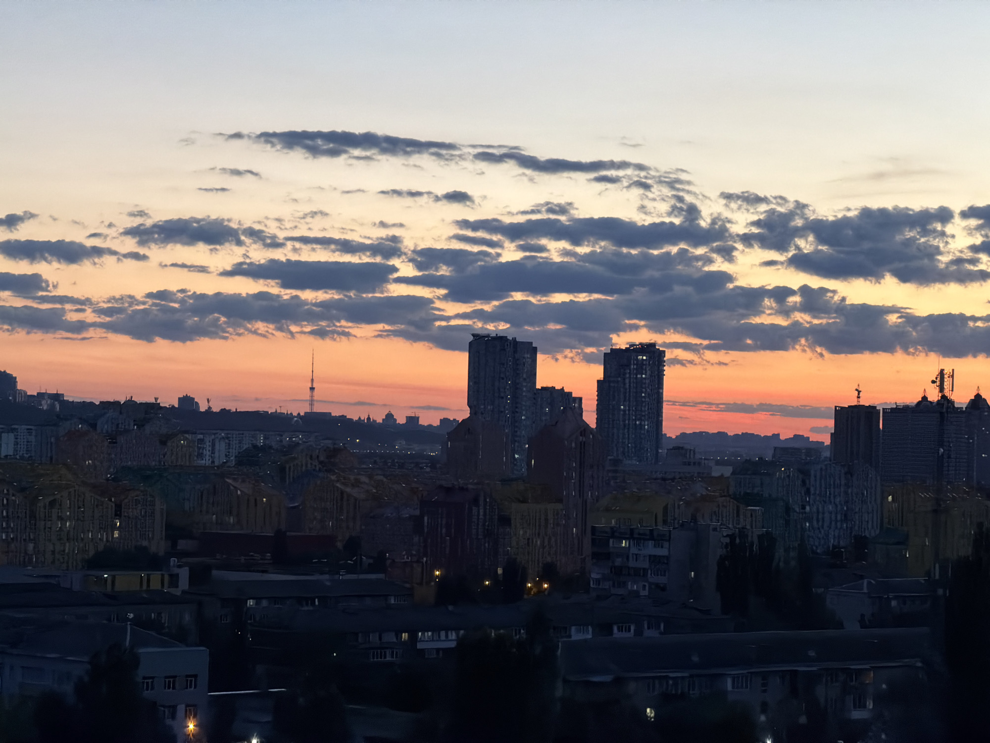 Kyiv evening: rooftop sunsets, a poodle, and city light
