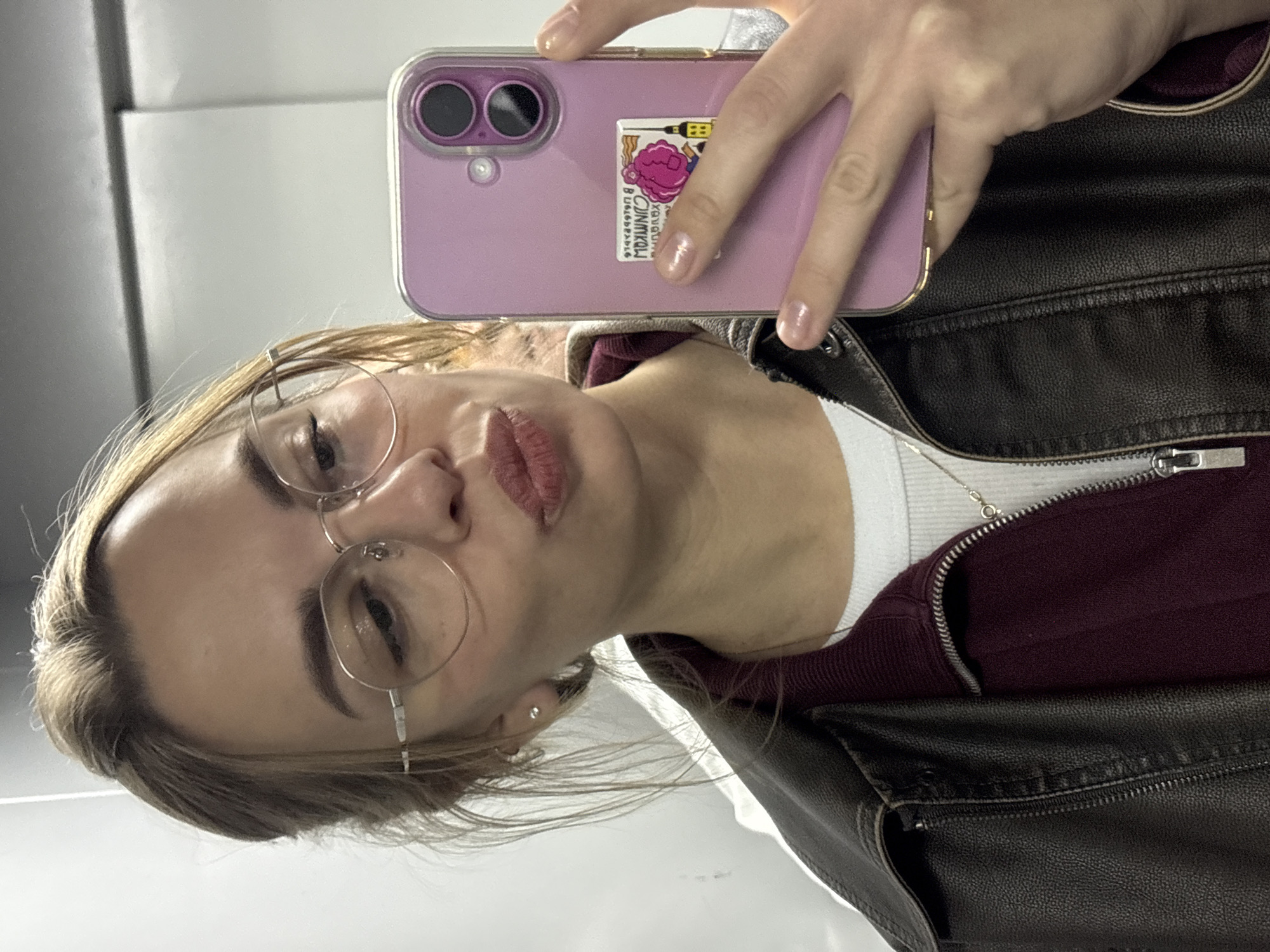 Woman takes selfie with decorated phone in Krasnoyarsk