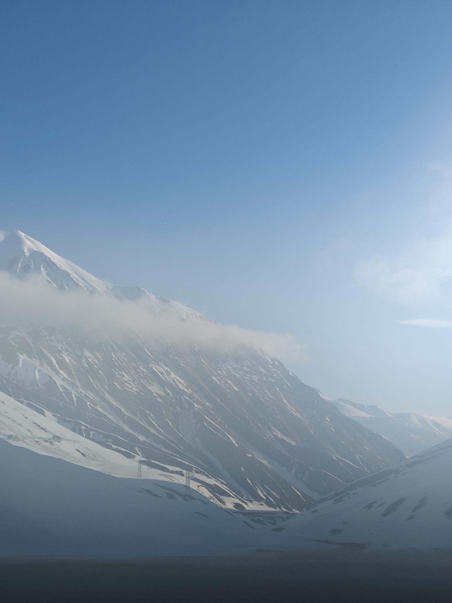 Snow-covered mountains documented near Ganisi, Georgia