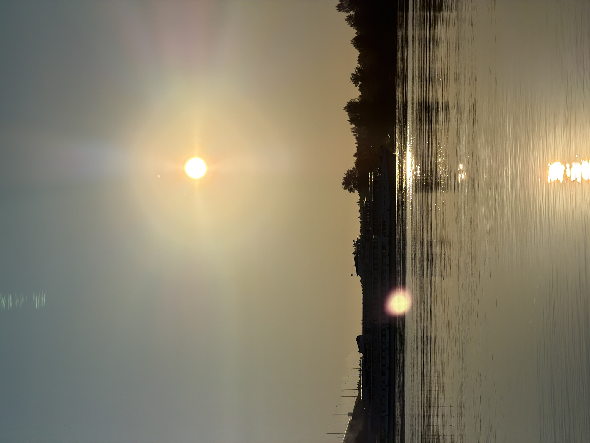 Sunset fishing on the Volga, bridge and cruise ship in view
