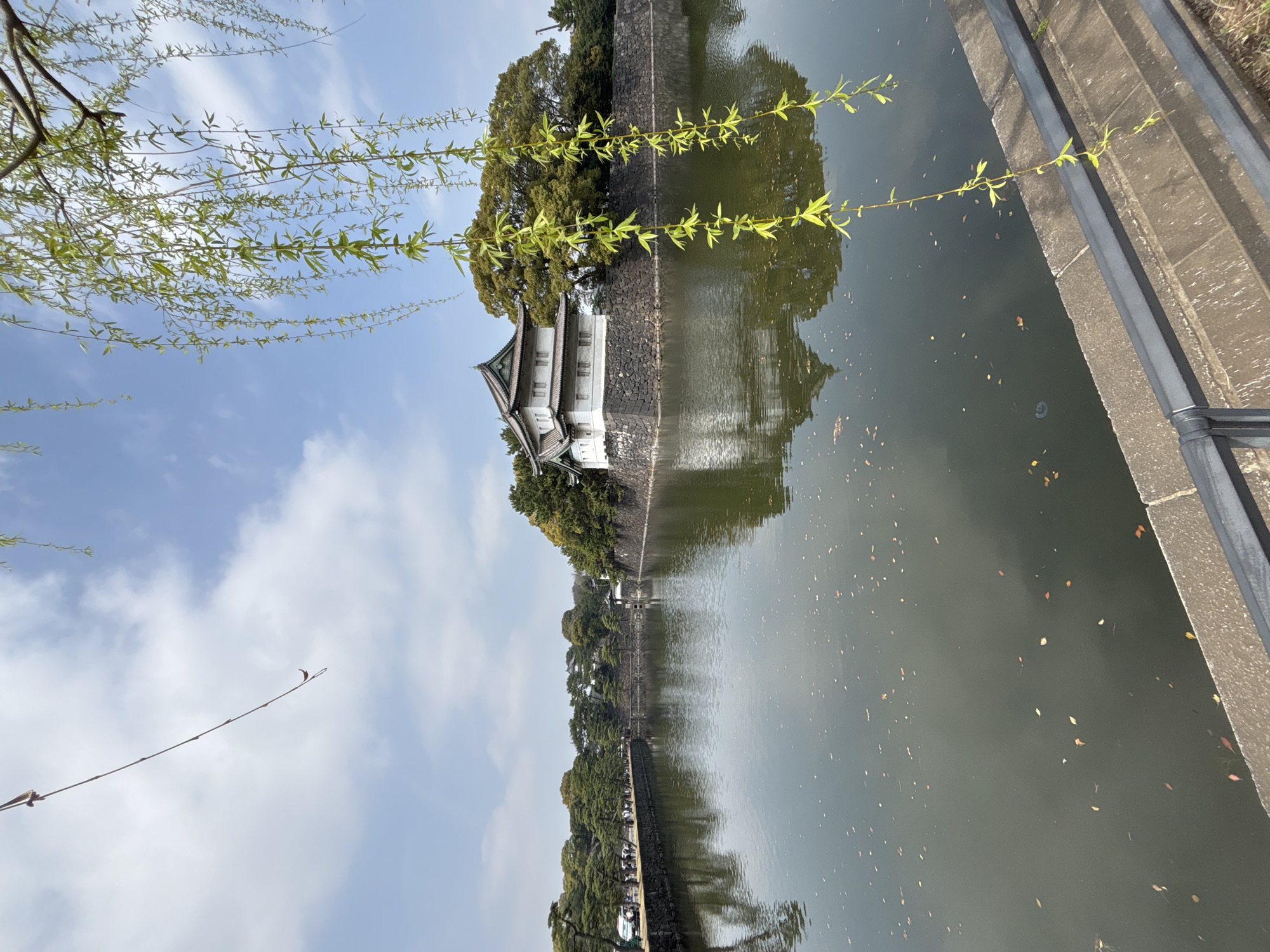 Traditional building reflected in Chiyoda moat captured