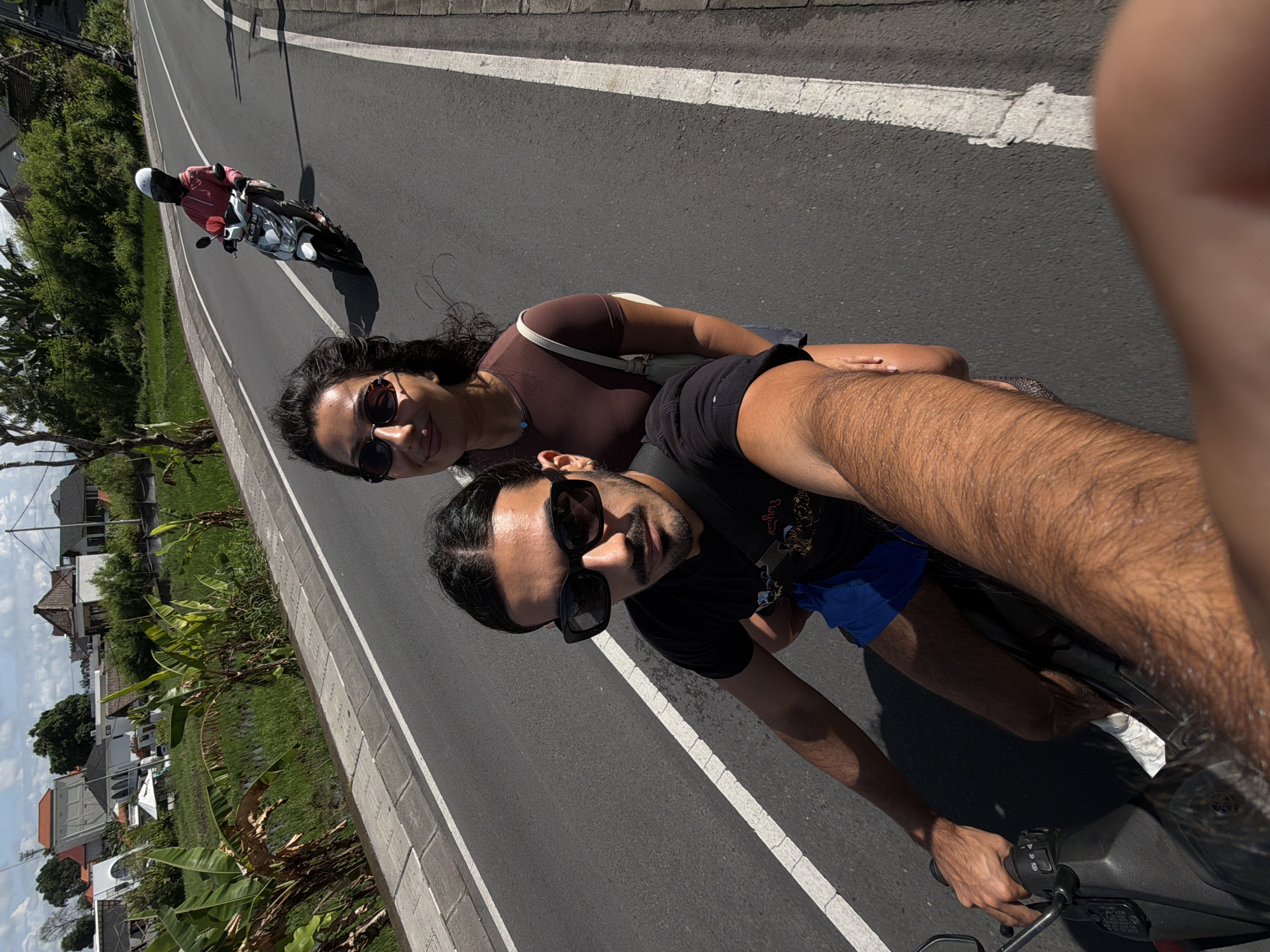 Couple films scooter ride selfies in North Kuta