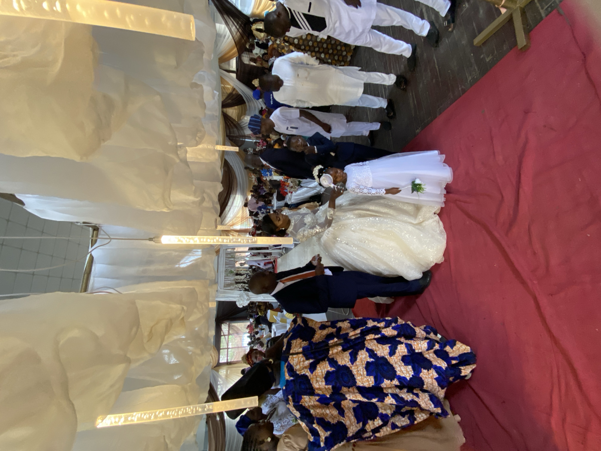 Wedding celebration in Bukuru, Nigeria, with dancing and ceremony moments.