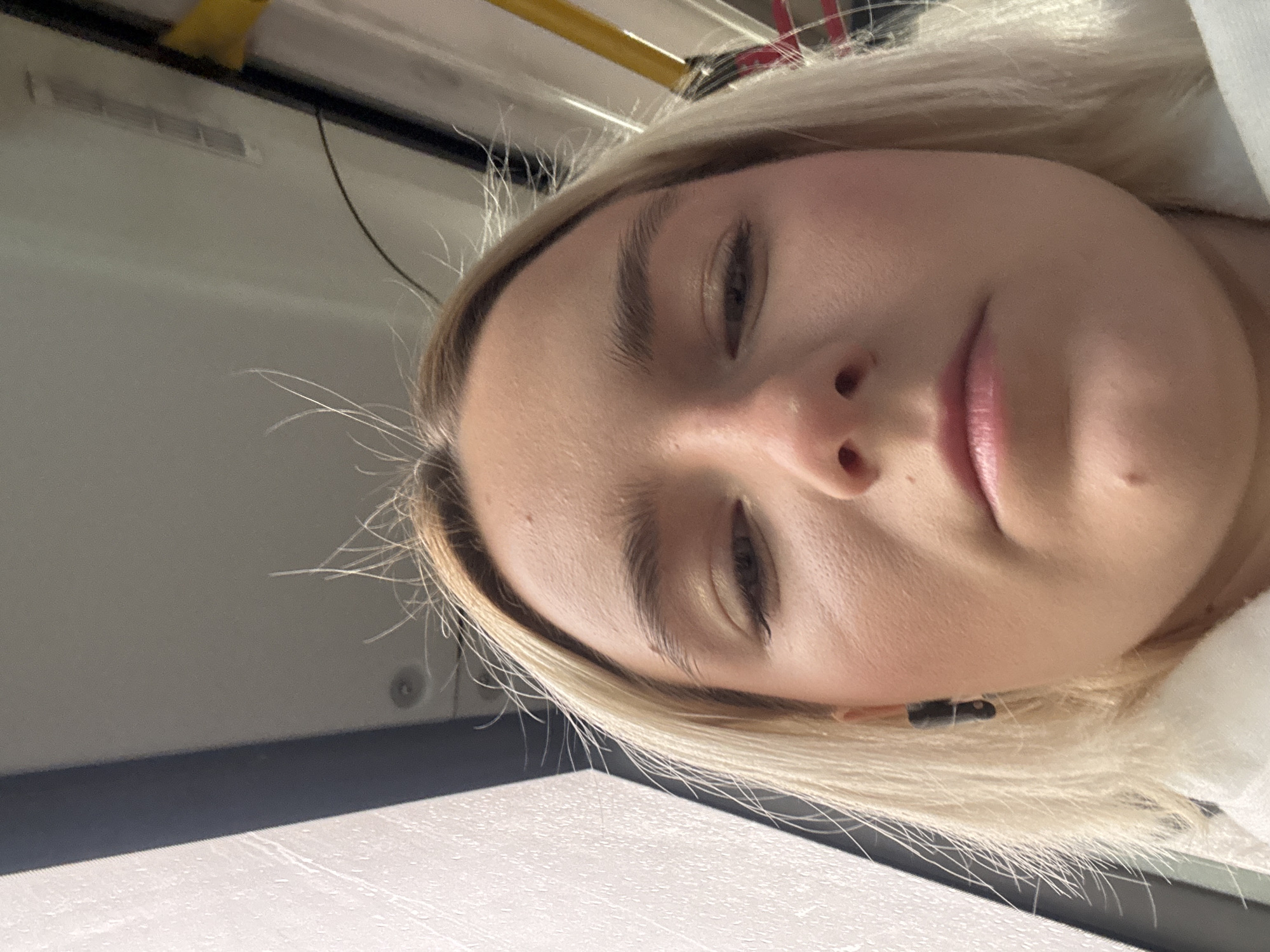 Woman takes early morning selfies on Saint Petersburg transit