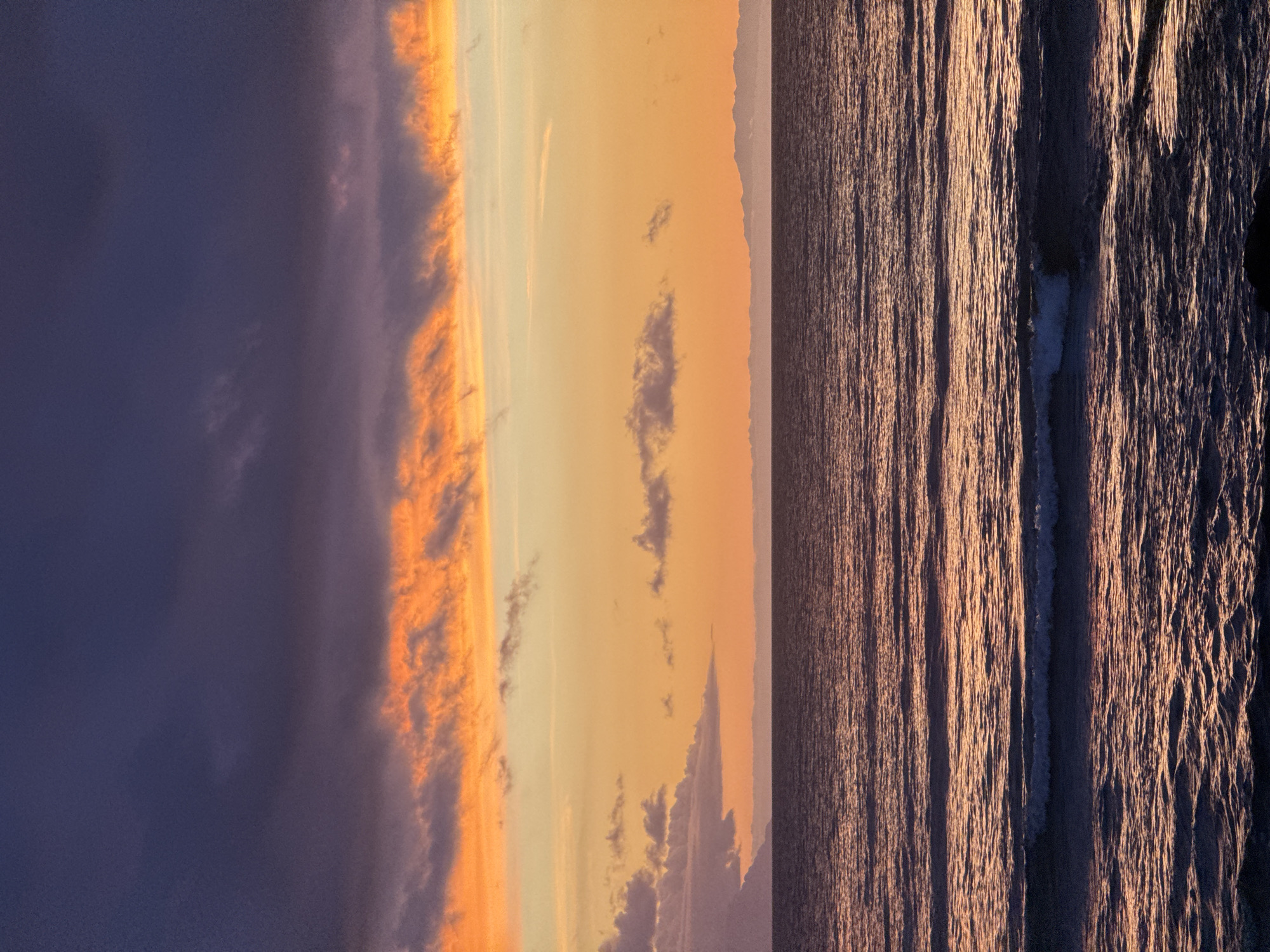 Vivid Atlantic sunset over Arona's rocky coastline