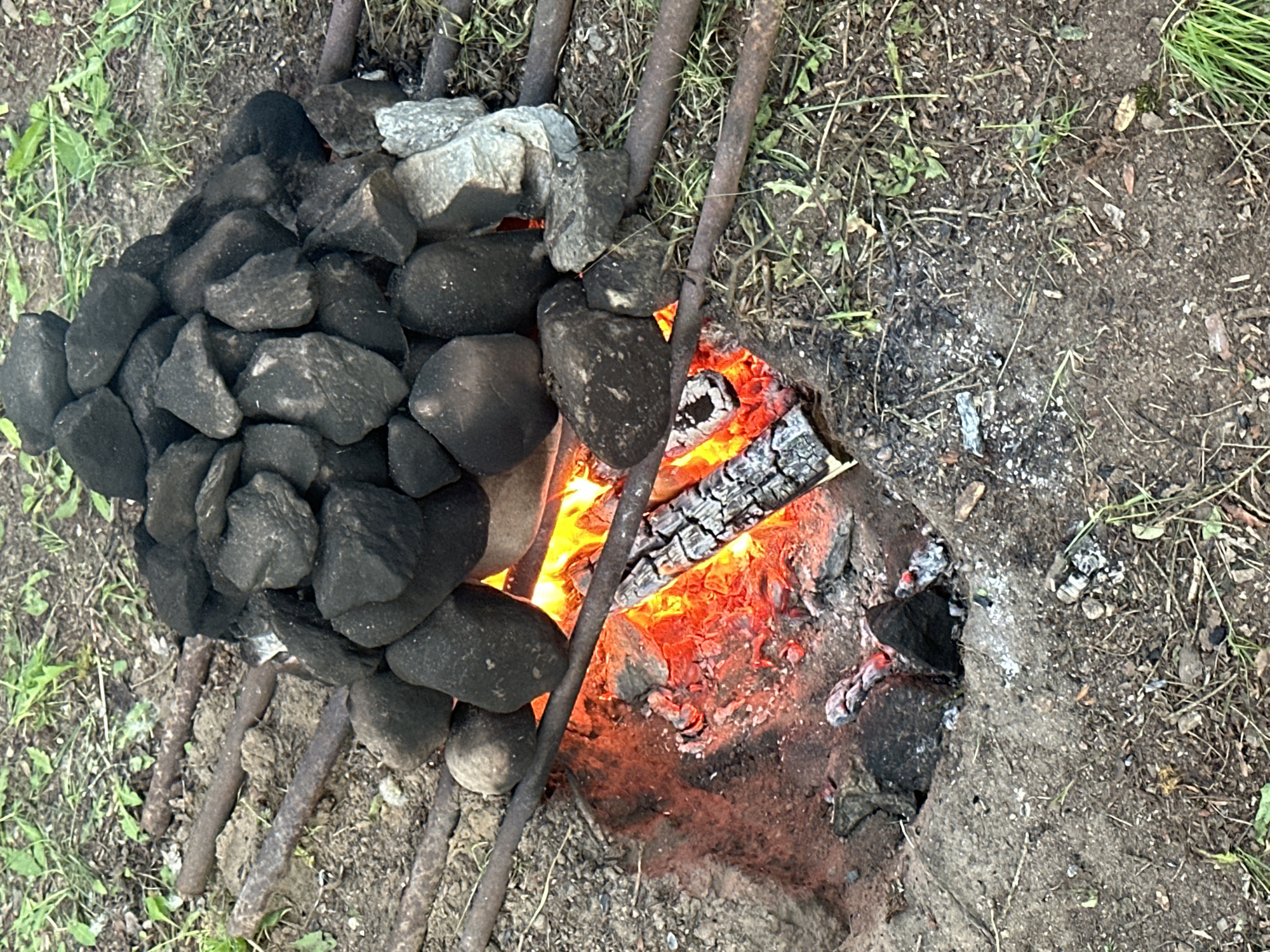 Traditional outdoor cooking fire documented in rural Belarus village