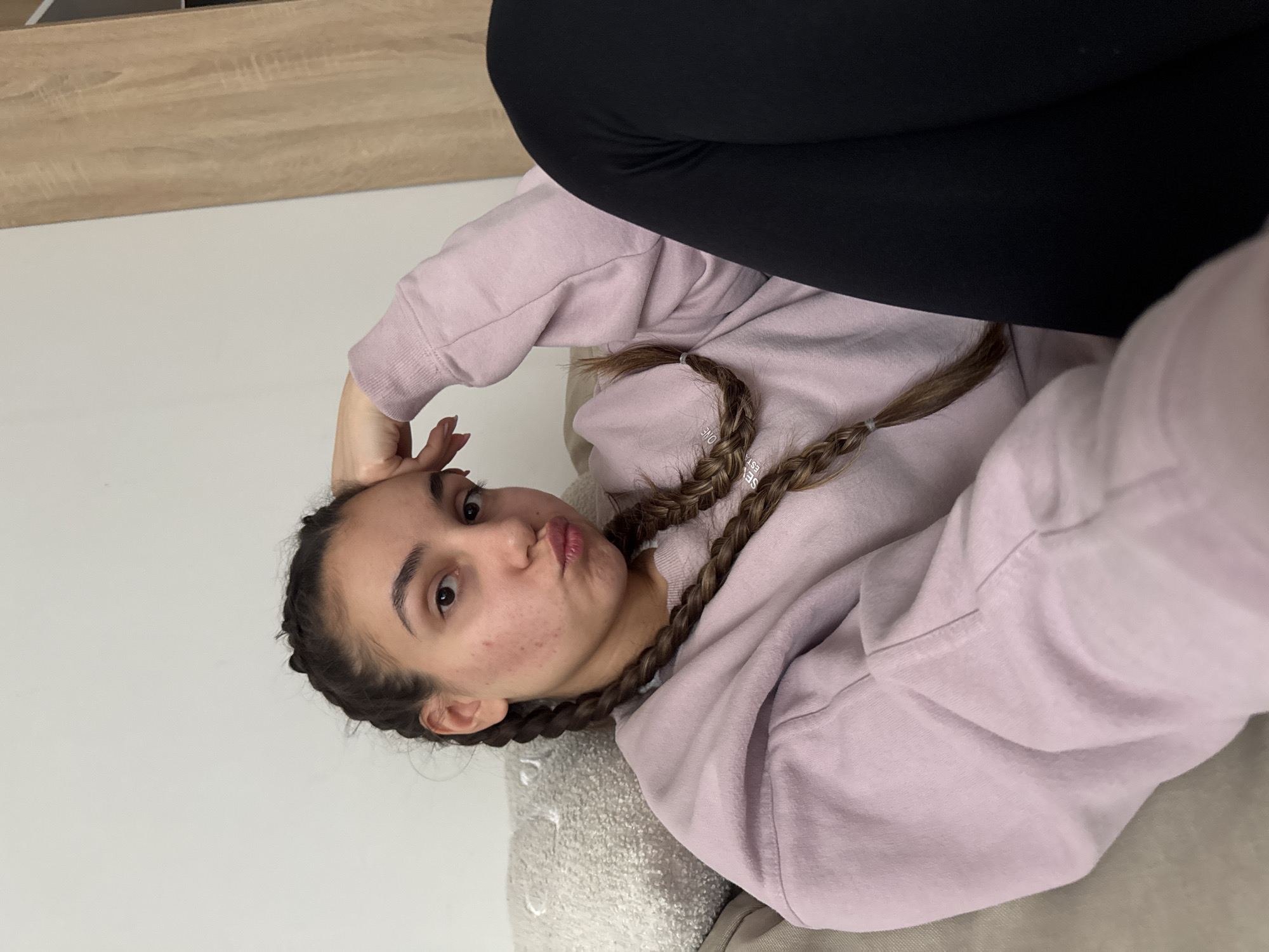 Woman relaxing on sofa in Sofia home setting