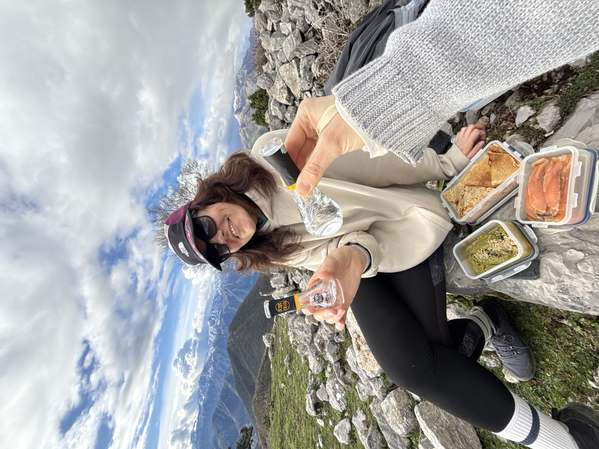 Woman poses at mountainous viewpoint near Baošići, Montenegro