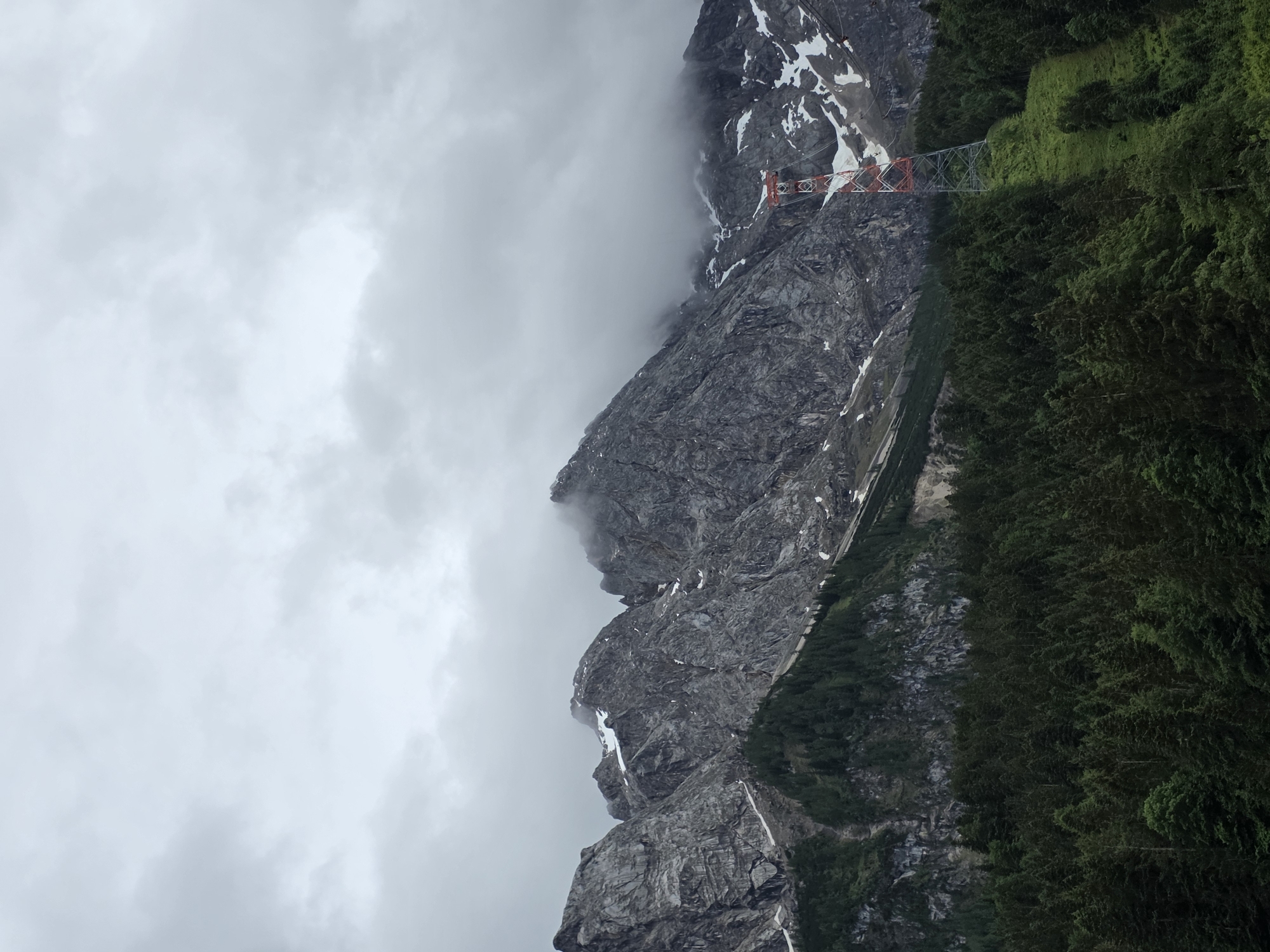Tourist documents Zugspitze cable car area in overcast conditions