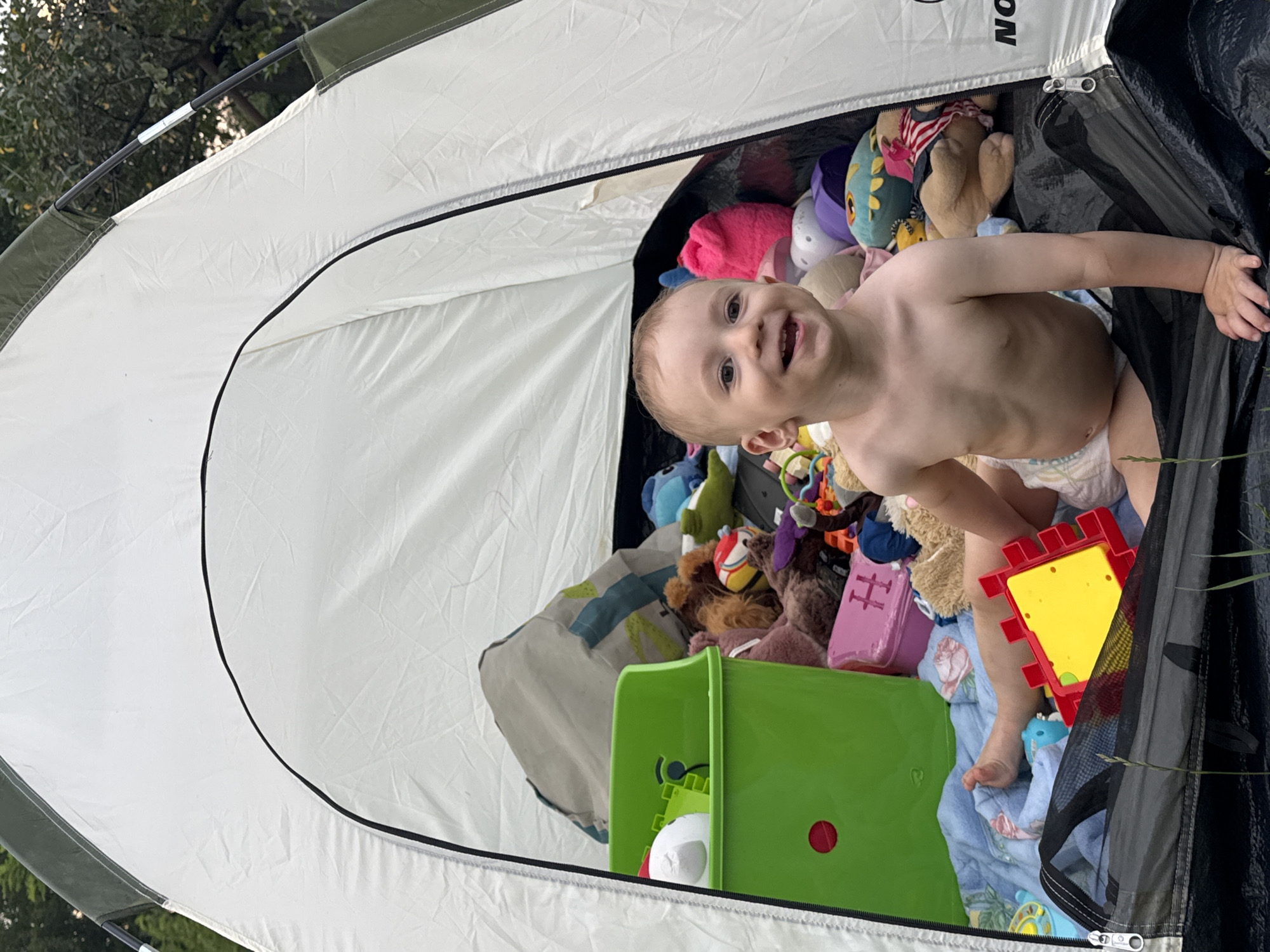 Kids' summer afternoon around a backyard tent in rural Russia