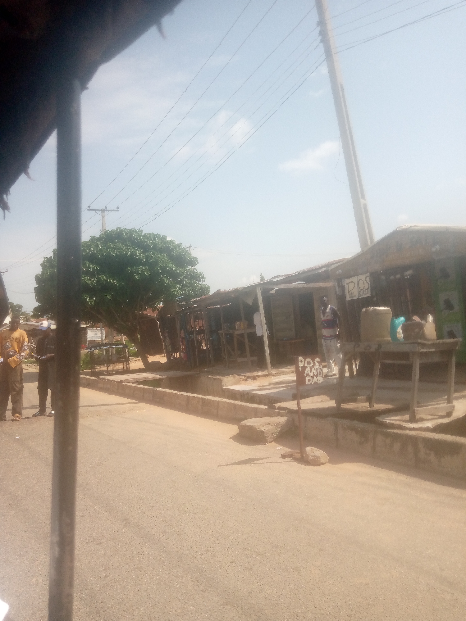 Morning street life in Jalingo, Nigeria, seen from Keke Napeps