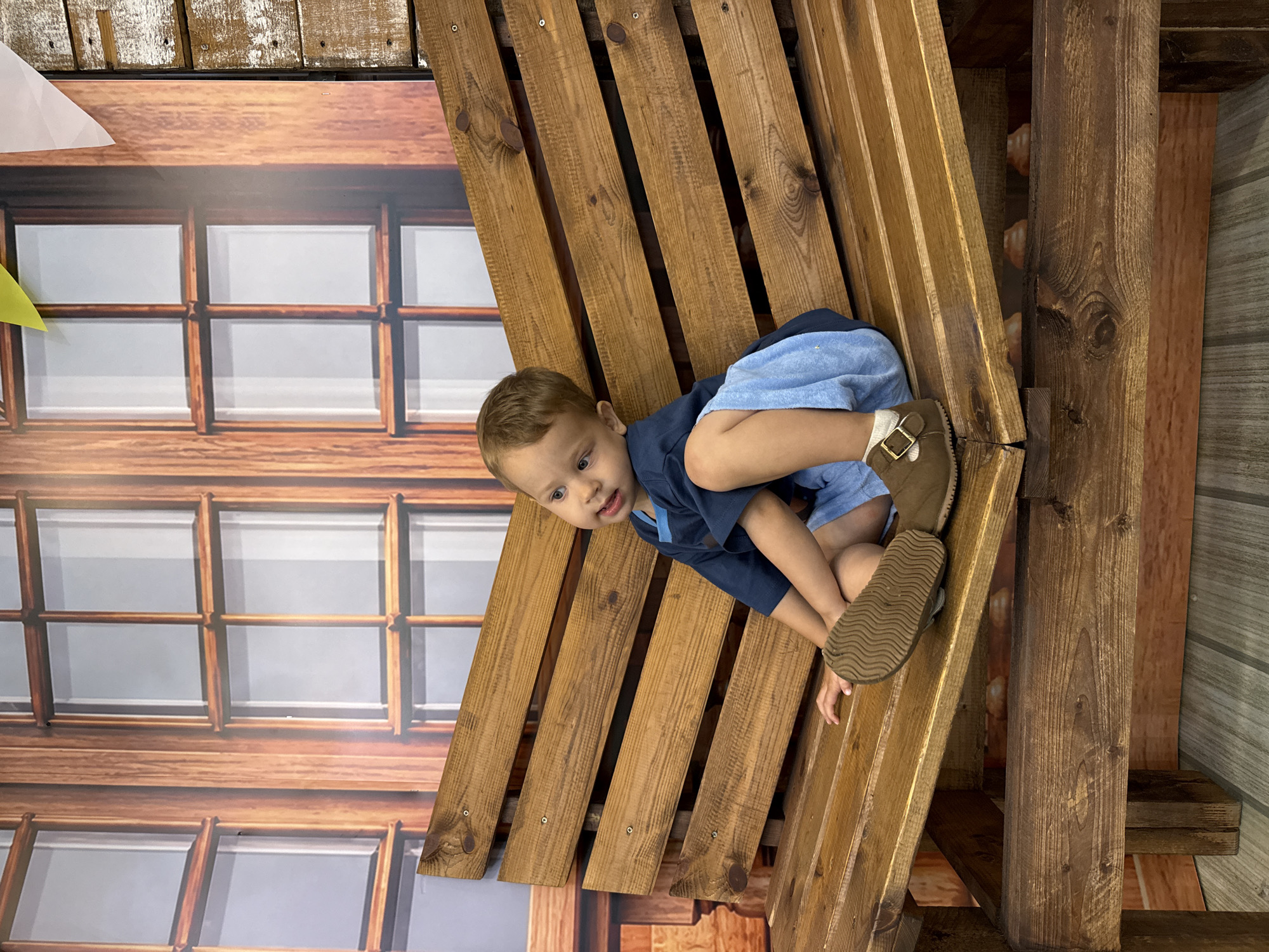 Rustic studio portrait session with child and adult, rural Russia