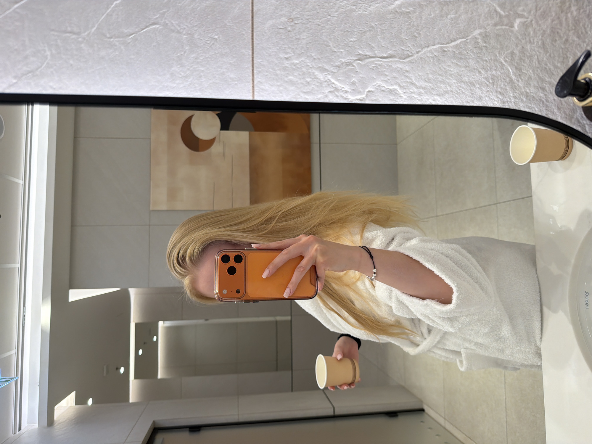 Woman documents spa visit with selfies and pool scenes