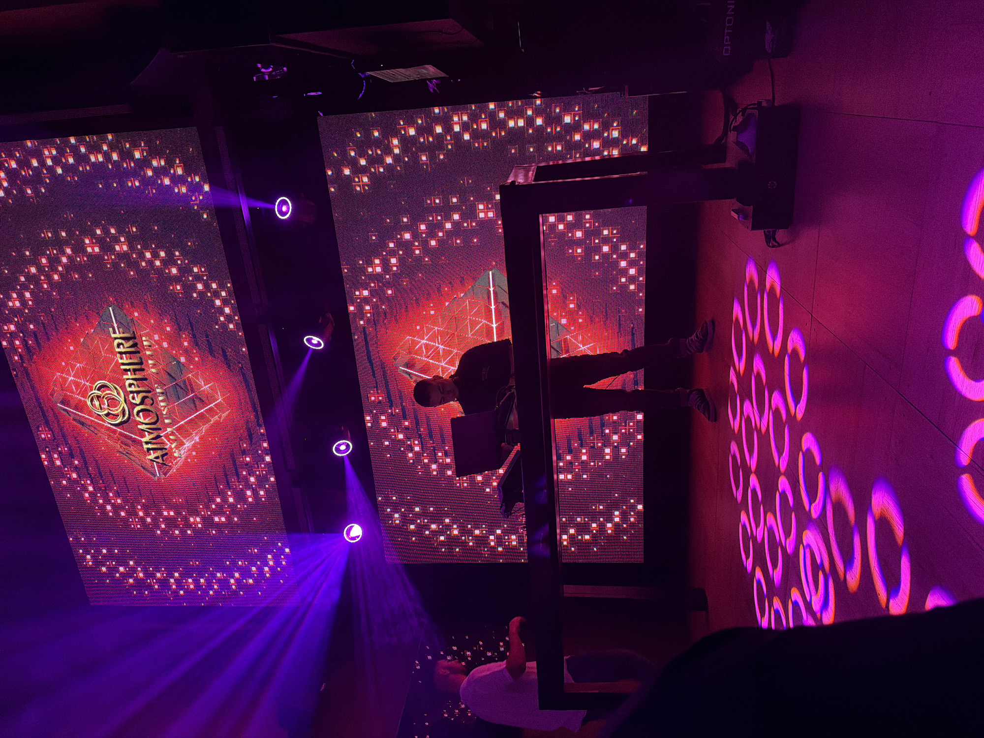 DJ performs at Atmosphere nightclub with digital displays